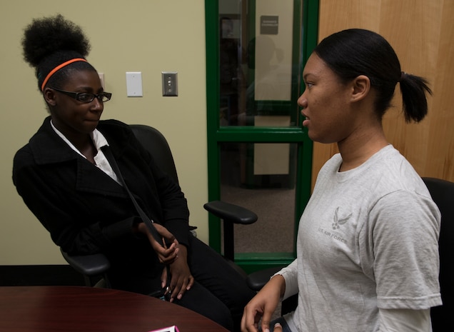 Airman 1st Class Tashanna Holt , 437th Aerial Port Squadron combat air transportation specialist, talks with Destiny Swenton , a student she mentors, Feb. 6, 2013, at Jerry Zucker Middle School of Science, S.C. Joint Base Charleston  has been a part of the mentorship program for 10 years, and it is the second year at this particular school. (U.S. Air Force photo/ Airman 1st Class Ashlee Galloway)