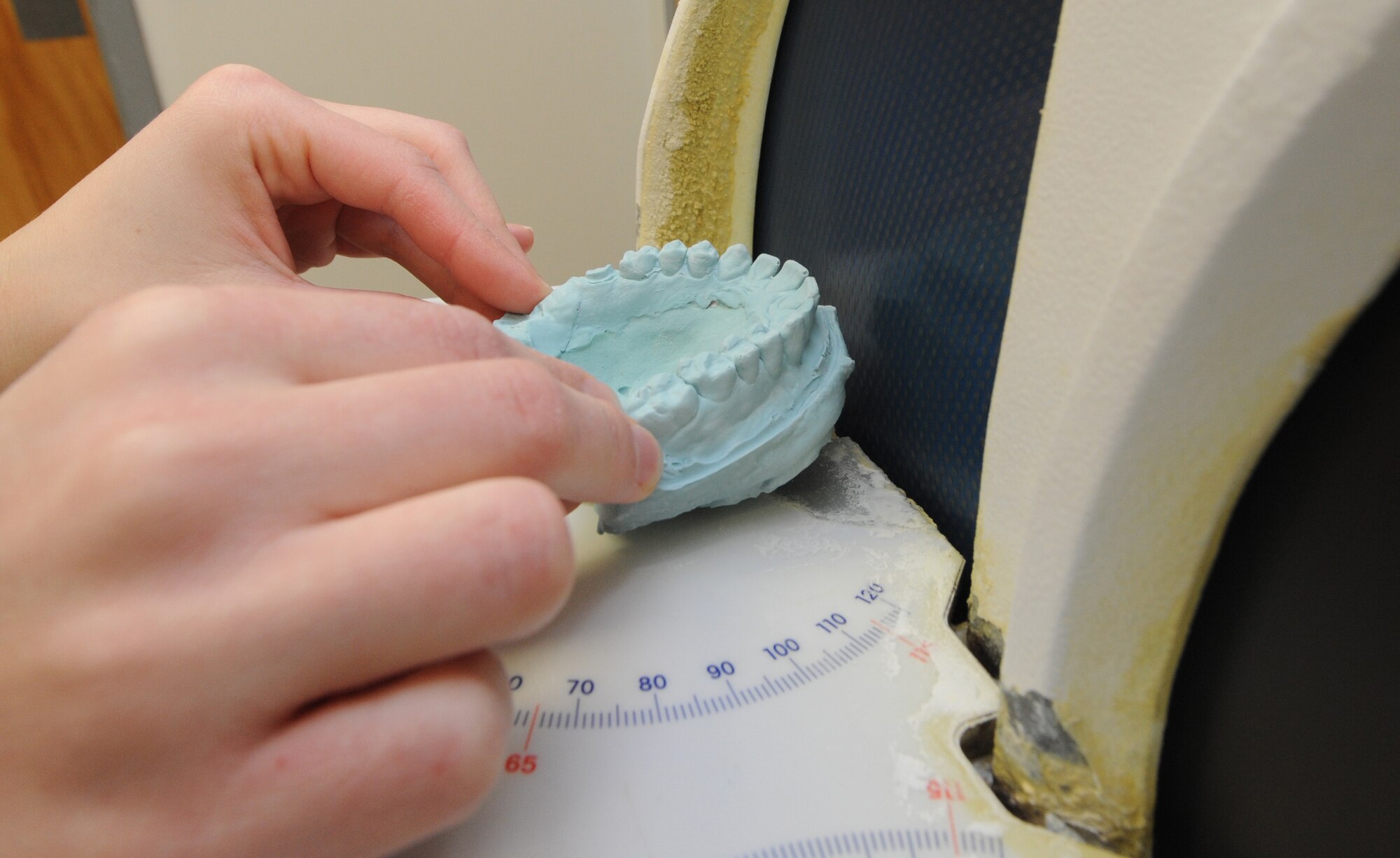WHITEMAN AIR FORCE BASE, Mo. -- Staff Sgt. Crystal Rucker, 509th Medical Operations Squadron dental technician, uses a model trimmer to trim a cast, Feb. 4. A cast is a model of a patient’s teeth. (U.S. Air Force photo/Staff Sgt. Nick Wilson)(Released)