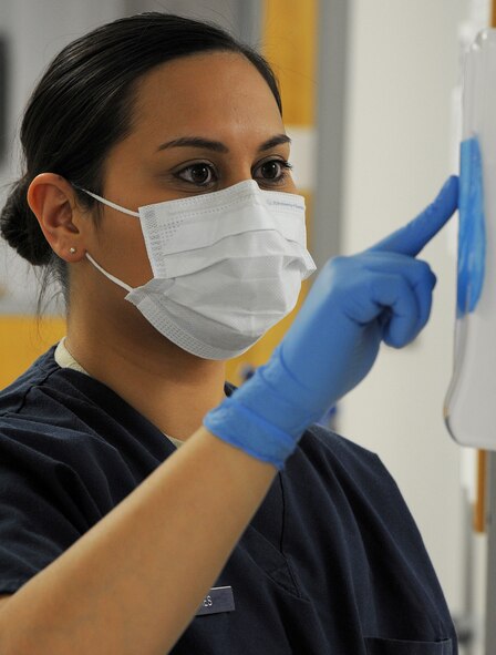 WHITEMAN AIR FORCE BASE, Mo. -- Staff Sgt. Jessica Sykes, 509th Medical Operations Squadron dental technician, performs a dental X-ray examination on a patient, Jan. 4. The X-ray helps dentists identify tooth decay and bone health. (U.S. Air Force photo/Staff Sgt. Nick Wilson) (Released)