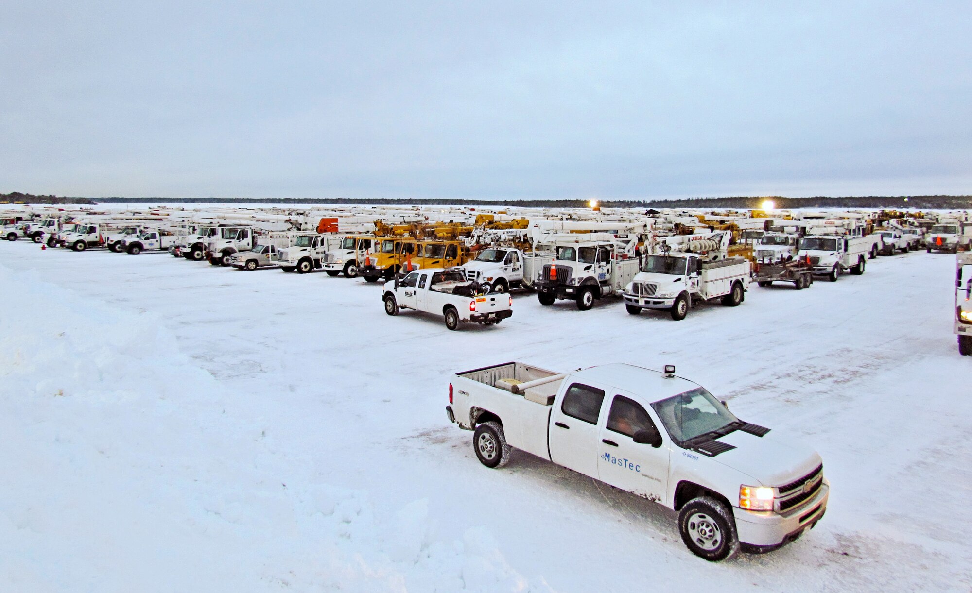 NStar Electric, a Northeastern utility company, is temporarily basing a large assembly of utility workers and vehicles here in order to more effectively restore electricity to the citizens of Cape Cod due to effects of the brutal winter storm that hit the area, 8-9 February.