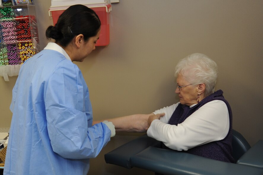 Staff Sgt. Jessica Portilla, 92nd Medical Support Squadron laboratory technician, draws blood from Gisele Bekemeyer, a patient, in the lab at Fairchild Air Force Base, Wash., Feb. 8, 2013. Bekemeyer has been coming to the lab since 1965. The laboratory technicians support more than 30-thousand beneficiaries, including active duty, retirees and dependents. (U.S. Air Force photo by Senior Airman Jordan Pollock) 