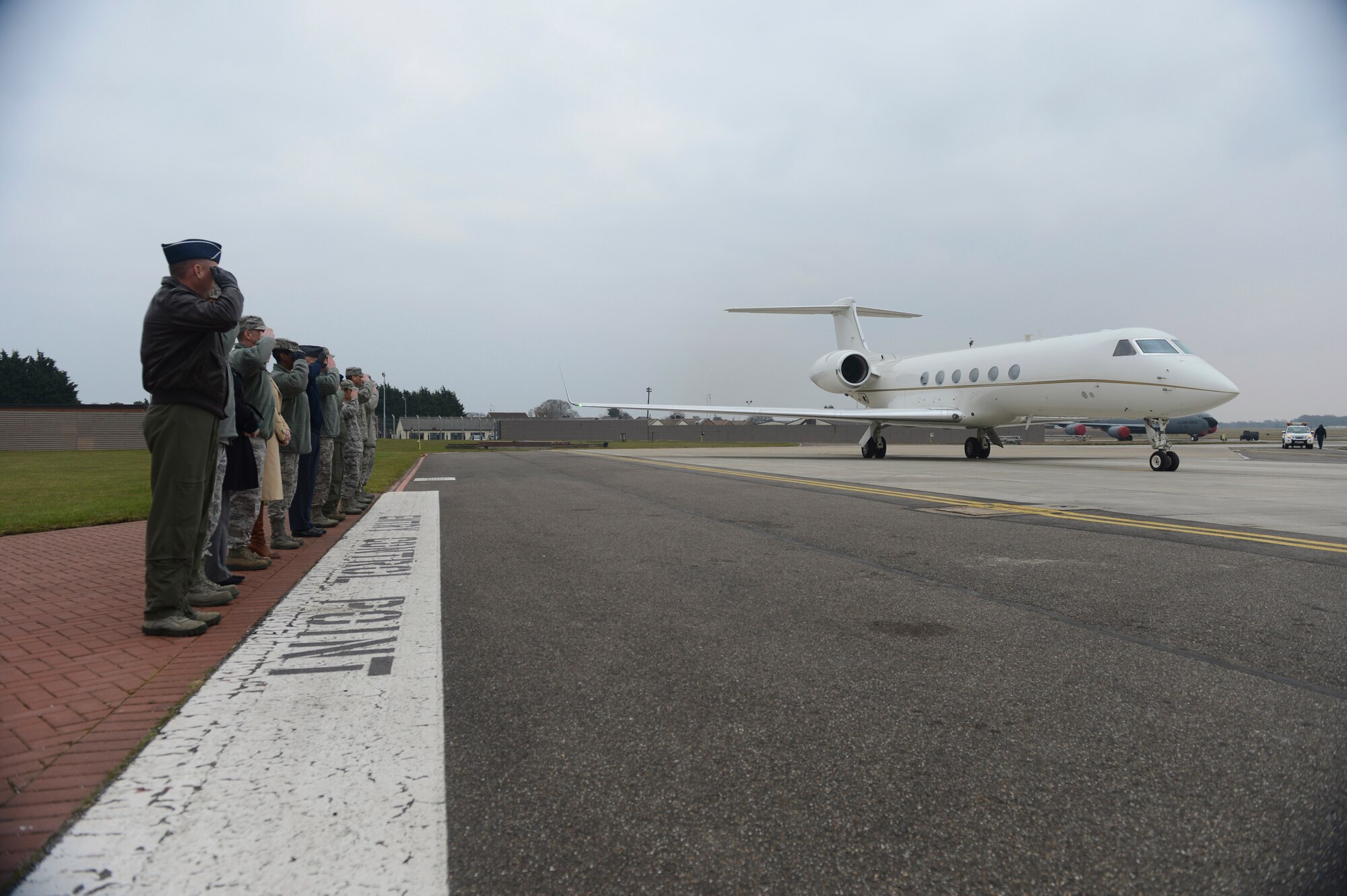 ROYAL AIR FORCE MILDENHALL, England - Members of RAFs Mildenhall and Lakenheath salute U.S. Navy Adm. James G. Stavridis, U.S. European Command commander and NATO Supreme Allied Commander Europe, upon his departure Feb. 12, 2013. The admiral toured RAFs Mildenhall and Lakenheath to visit U.S. and NATO assets assigned in the U.K. (U.S. Air Force photo by Staff Sgt. Stephen Linch)