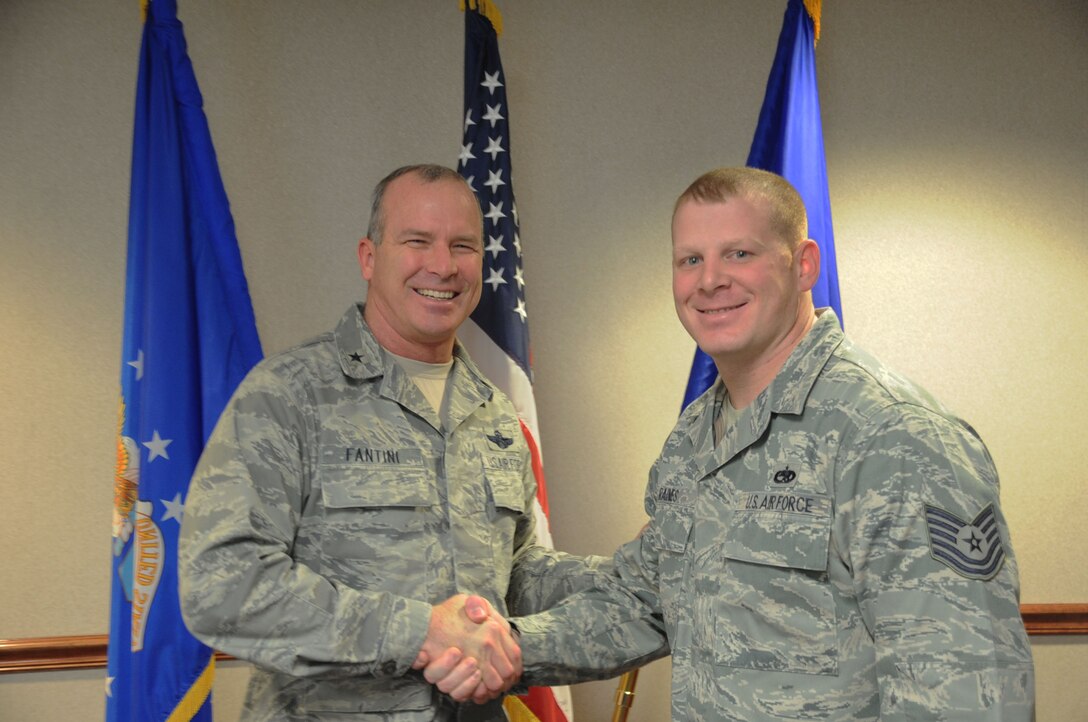 Brig. Gen. Michael Fantini (left), 82nd Training Wing commander, congratulates Tech. Sgt. Tim Raines, 365th Training Squadron, on being named the commander's "Wingman of Choice" for Feb. 11-15.  The award is given for outstanding duty performance and being a good wingman. (U.S. Air Force photo/Dan Hawkins)