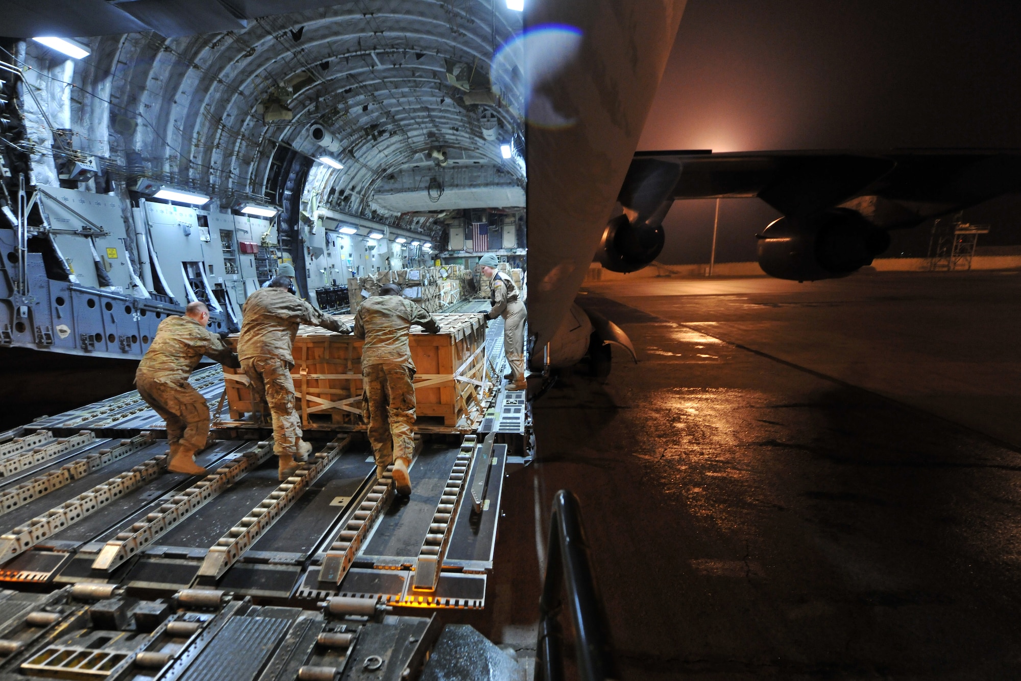 Airmen from 455th Expeditionary Aerial Port Squadron, Detachment 3, load pallets onto a C-17 Globemaster III at Camp Marmal, Afghanistan, Jan 30, 2013. Airmen belonging to the 455th EAPS are charged with unloading and loading every aircraft carrying supplies or personnel into and out of Camp Marmal supporting the International Security Assistance Force Regional Command-North’s transportation mission. (U.S. Air Force photo/Senior Airman Chris Willis)