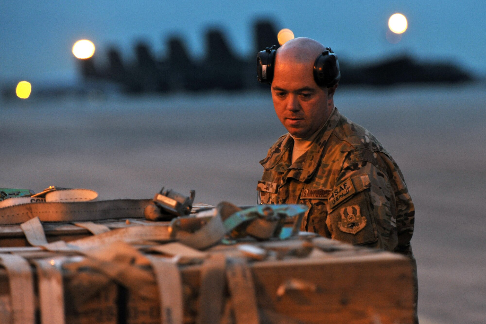 Tech. Sgt. Jason E. Goul, 455th Expeditionary Aerial Port Squadron, Detachment 3 Aerial Port specialist, builds pallets at the contingency cargo staging yard on Camp Marmal, Afghanistan, Jan 30, 2013. Goul is deployed from the 60th Aerial Port Squadron, Travis Air Force Base, Calif., supporting the International Security Assistance Force Regional Command-North’s transportation mission.  (U.S. Air Force photo/Senior Airman Chris Willis)