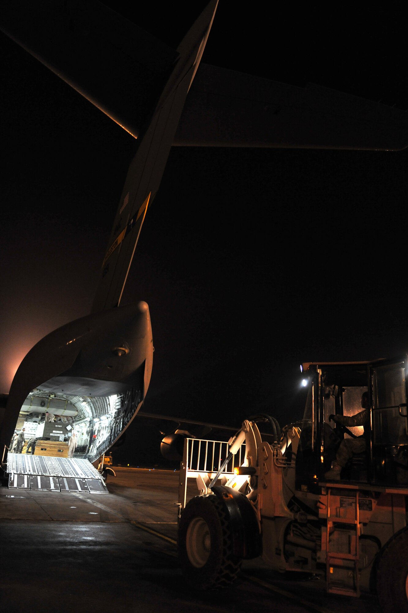 Airmen from 455th Expeditionary Aerial Port Squadron, Detachment 3, load pallets onto a C-17 Globemaster III at Camp Marmal, Afghanistan, Jan 30, 2013. Airmen belonging to the 455th EAPS are charged with unloading and loading every aircraft carrying supplies or personnel into and out of Camp Marmal supporting the International Security Assistance Force Regional Command-North’s transportation mission. (U.S. Air Force photo/Senior Airman Chris Willis)