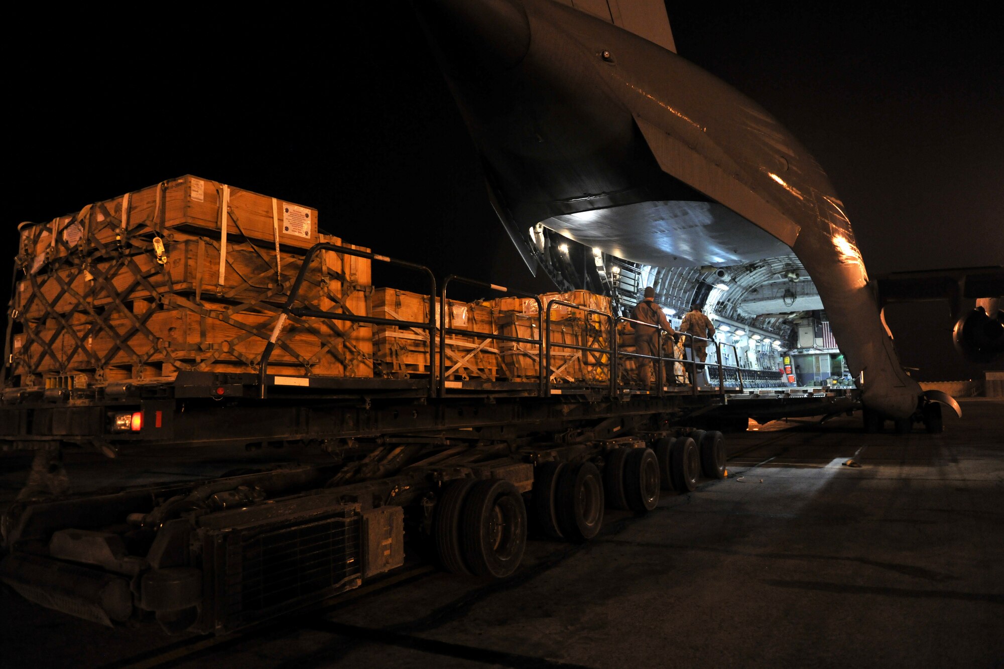 Airmen from 455th Expeditionary Aerial Port Squadron, Detachment 3, load pallets onto a C-17 Globemaster III at Camp Marmal, Afghanistan, Jan 30, 2013. Airmen belonging to the 455th EAPS are charged with unloading and loading every aircraft carrying supplies or personnel into and out of Camp Marmal supporting the International Security Assistance Force Regional Command-North’s transportation mission. (U.S. Air Force photo/Senior Airman Chris Willis)