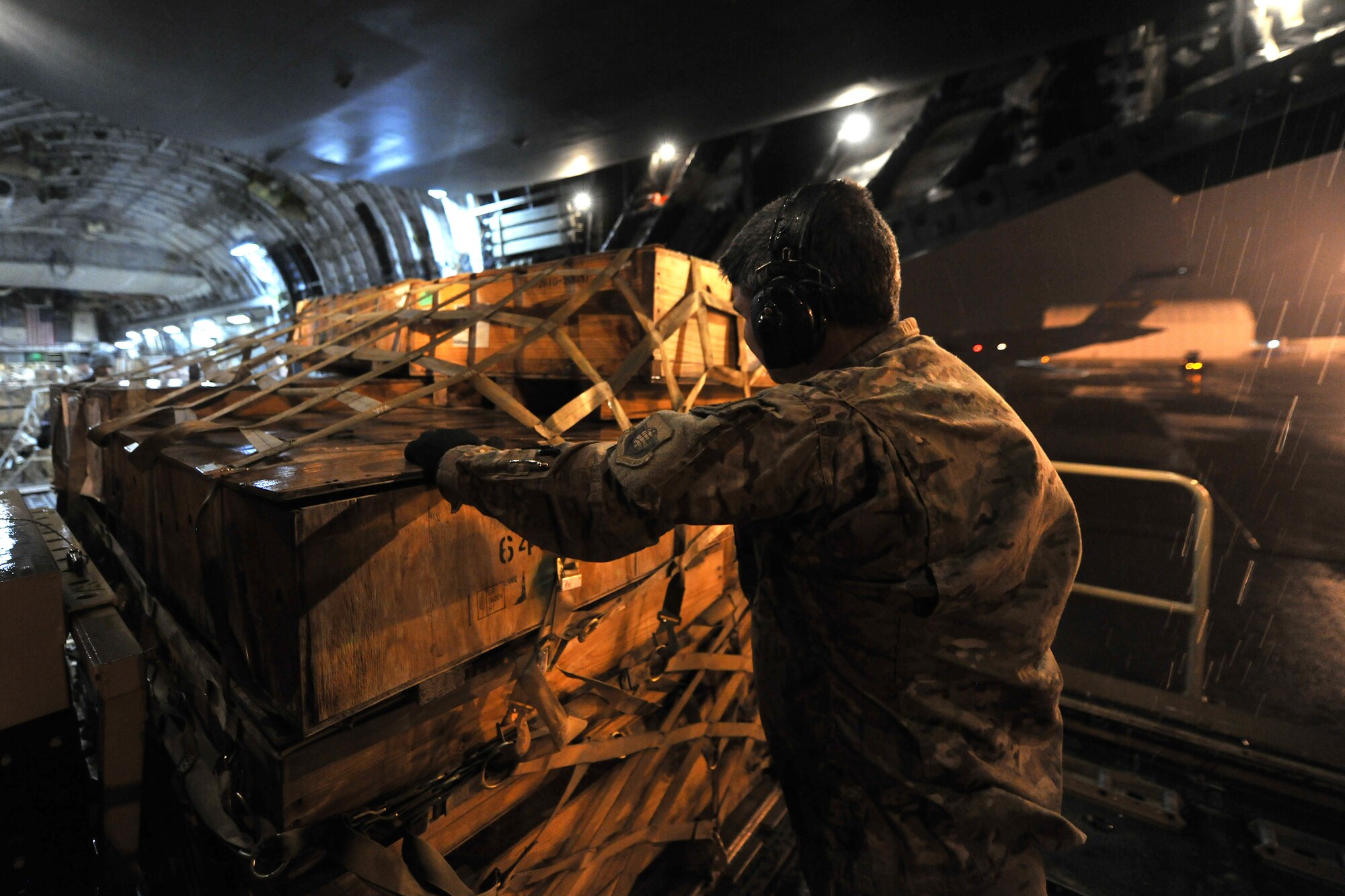 Master Sgt. Joel Graham, 455th Expeditionary Aerial Port Squadron, Detachment 3 chief, loads pallets onto a C-17 Globemaster III at Camp Marmal, Afghanistan, Jan 30, 2013. Airmen from the 455th EAPS are forward deployed from Bagram Airfield, Afghanistan, to support the main Air Force contingency cargo staging yard in Regional Command-North. (U.S. Air Force photo/Senior Airman Chris Willis)