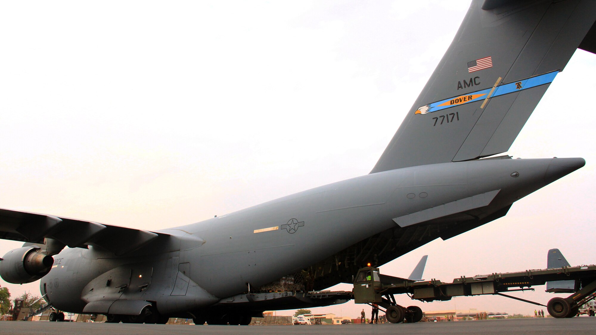 French soldiers assist aircrew from the 4th Airlift Squadron, 62nd Airlift Wing, McChord Air Force Base unload French military cargo after their transportation flight on January 25, 2013 from Base Aerienne 125, Istres, France to Mali. Flight included transportation of military vehicles, equipment, and personnel.  (U.S. Air Force photo by Senior Airman Brandi Hansen/Released)