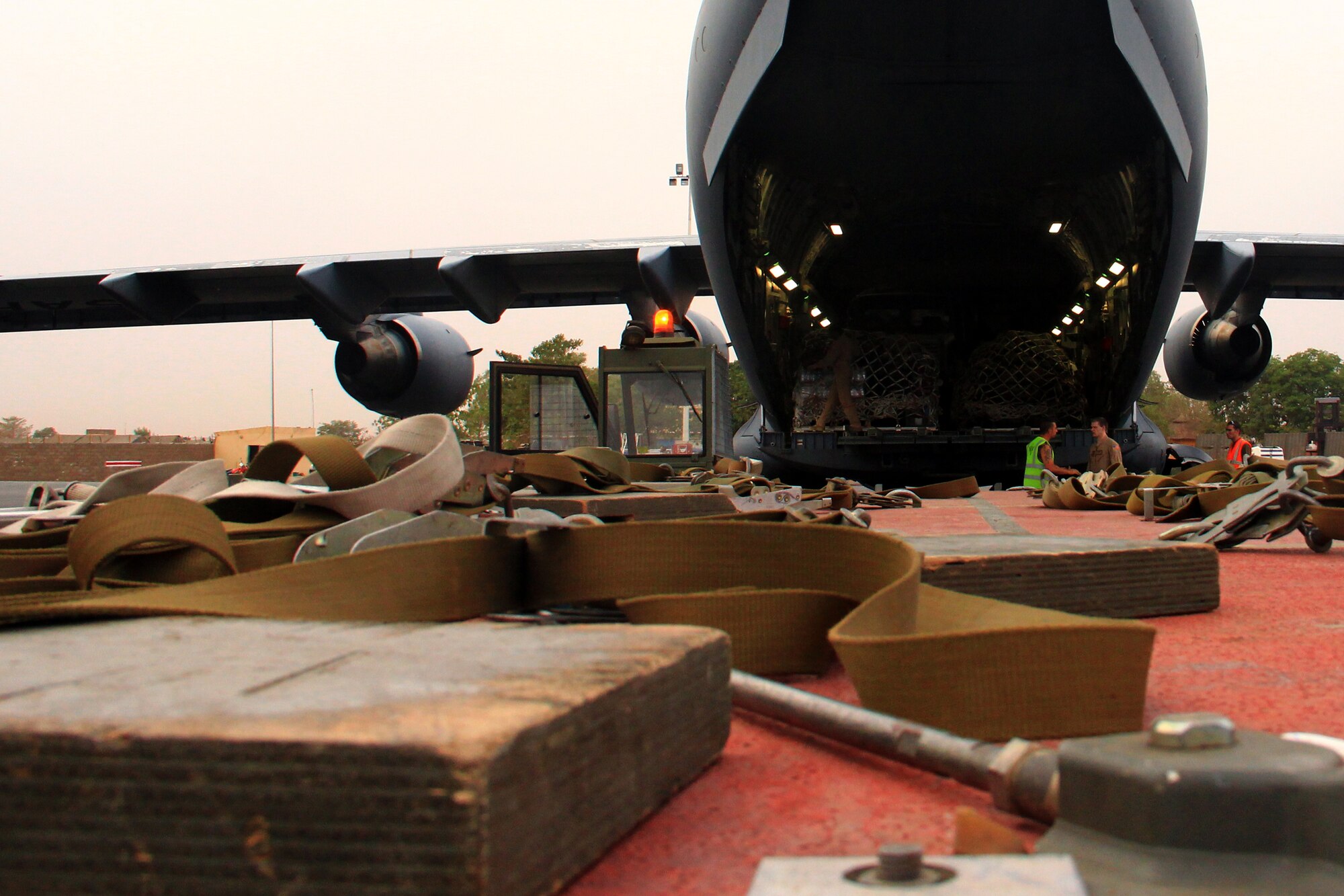 French soldiers assist aircrew from the 4th Airlift Squadron, 62nd Airlift Wing, McChord Air Force Base unload French military cargo after their transportation flight on January 25, 2013 from Base Aerienne 125, Istres, France to Mali. Flight included transportation of military vehicles, equipment, and personnel.  (U.S. Air Force photo by Senior Airman Brandi Hansen/Released)