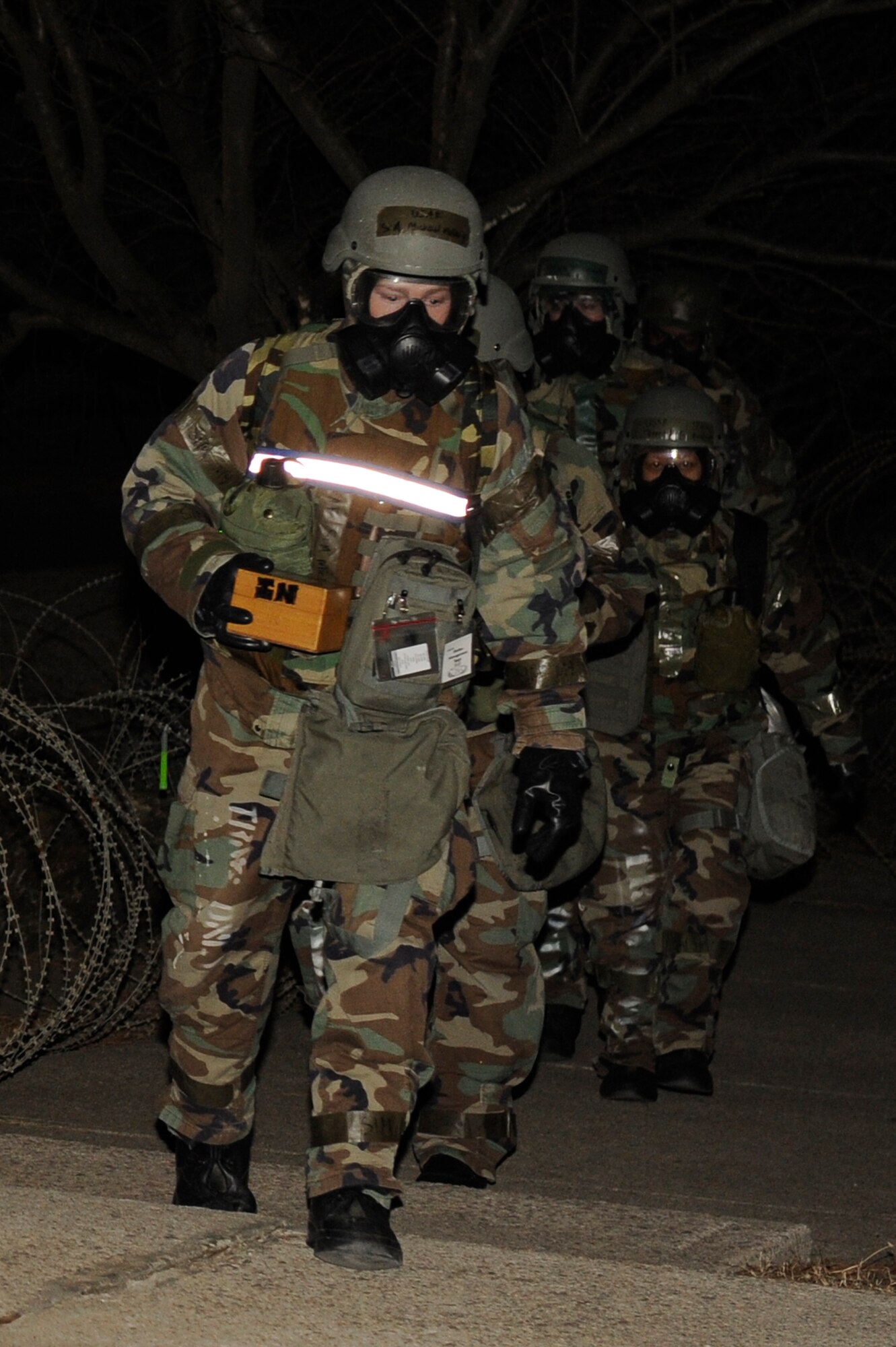 KUNSAN AIR BASE, Republic of Korea --  Members of the 8th Fighter Wing staff “bug-out” after a simulated fire in the building during the early morning hours of exercise Beverly Bulldog 13-2 at Kunsan Air Base, Republic of Korea, Feb. 13, 2013. The scenario tested the members’ ability to work from an alternate location while completing the mission. (U.S. Air Force photo by Senior Airman Marcus Morris/Released)