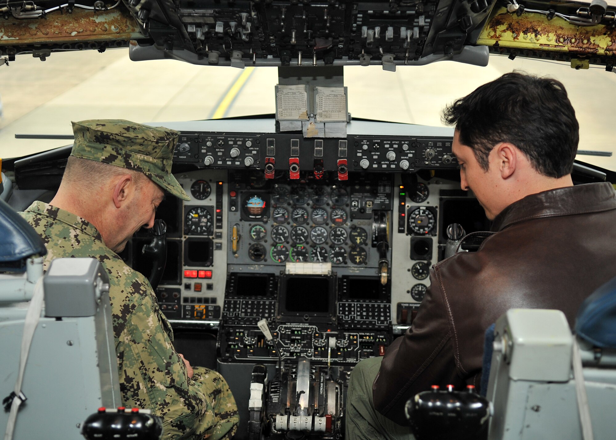 Right, U.S. Air Force Capt. Michael McFarland, 100th Operations Group assistant officer in charge of standardizations and evaluations, briefs U.S. Navy Admiral James Stavridis, U.S. European Command commander and NATO’s Supreme Allied Commander Europe, on board a KC-135 Stratotanker Feb. 12, 2013, at RAF Mildenhall, England. The admiral visited RAF Mildenhall and RAF Lakenheath on a site visit touring U.S. and NATO assets assigned in the U.K. (U.S. Air Force photo by Senior Airman Jerilyn Quintanilla/Released) 