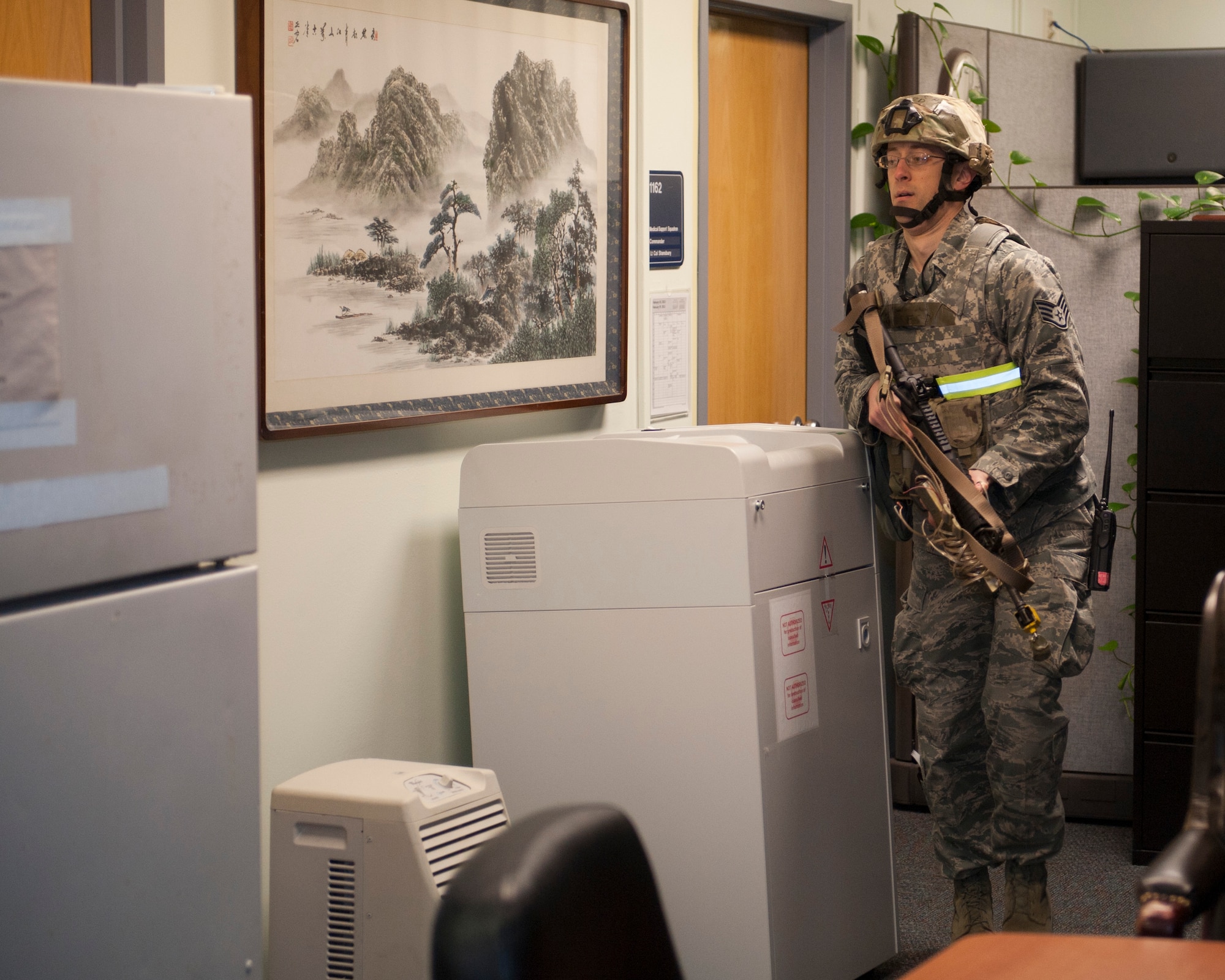 KUNSAN AIR BASE, Republic of Korea - Staff Sgt. Michael Harkavi, 8th Civil Engineer Squadron Explosive Ordinance Disposal member, storms into the 8th Medical Group clinic at Kunsan Air Base, Republic of Korea, Feb. 12, 2013. Harkavi acted as the active shooter, and fatally wounded two Airmen and injured 10 others. The scenario was part of exercise Beverly Bulldog 13-2.  (U.S. Air Force photo by Tech. Sgt Michael Schocker)