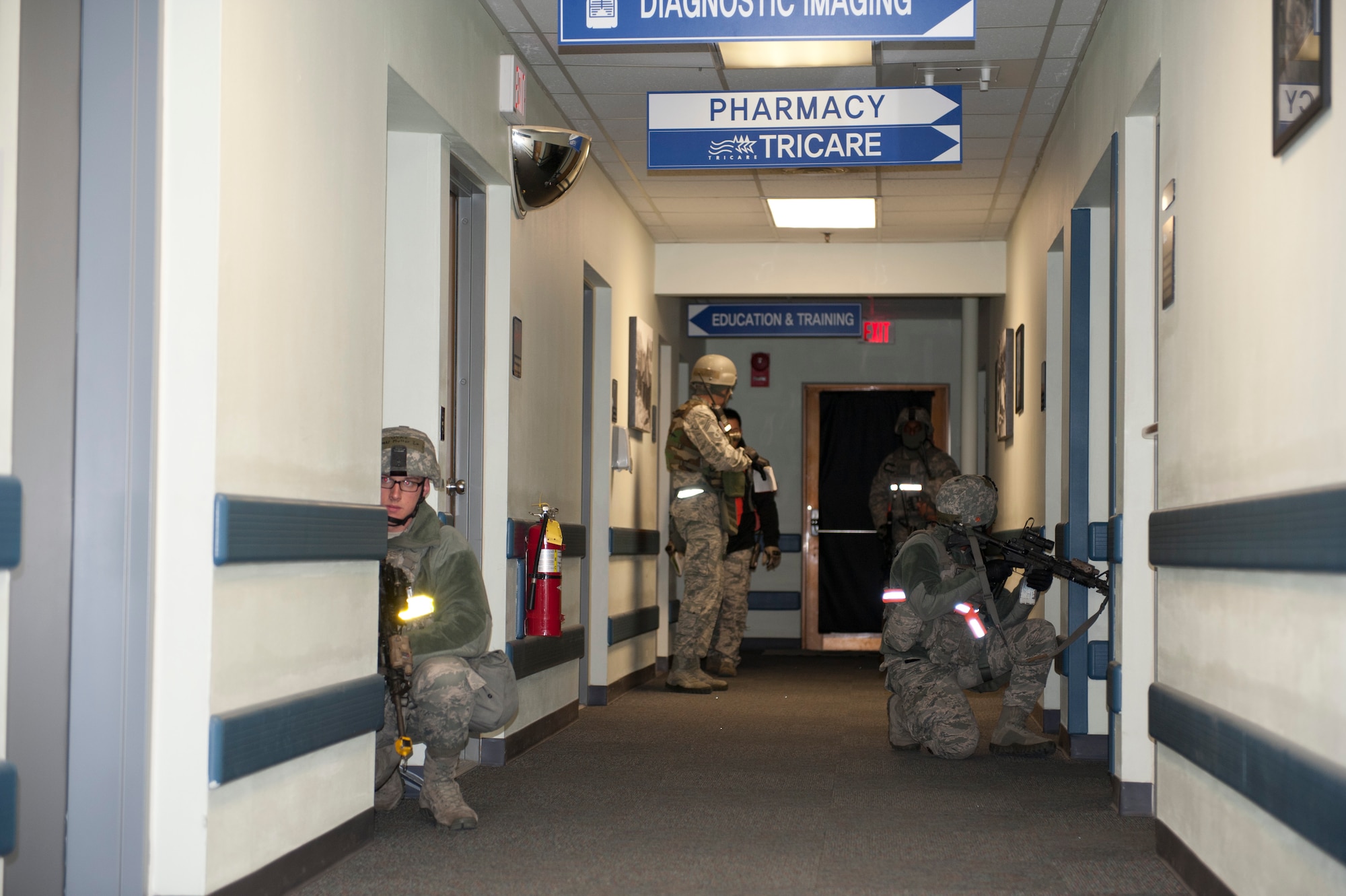 KUNSAN AIR BASE, Republic of Korea - 8th Security Forces Squadron members pull security during an active shooter scenario at the 8th Medical Group Clinic at Kunsan Air Base, Republic of Korea, Feb. 12, 2013. The scenario was part of exercise Beverly Bulldog 13-2, stressing vigilance and testing the readiness of Wolf Pack members. (U.S. Air Force photo by Tech. Sgt Michael Schocker) 