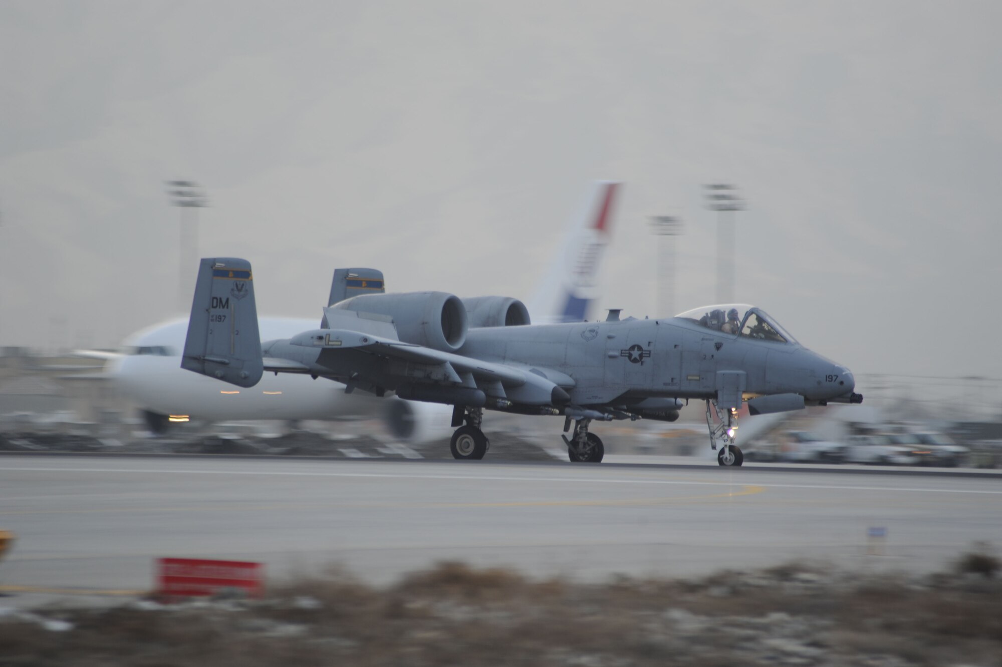 An A-10 Thunderbolt II fighter aircraft lands on Bagram Airfield, Afghanistan, Feb. 12, 2013. This aircraft, piloted by 455th Air Expeditionary Wing Commander Brig. Gen. Joseph T. Guastella, Jr., logged the 10,000th combat flight hour for the 354th Expeditionary Fighter Squadron since the unit?s arrival at Bagram in October 2012. The 354th EFS is deployed from Davis-Monthan Air Force Base, Ariz. (U.S. Air Force photo/Staff Sgt. David Dobrydney)