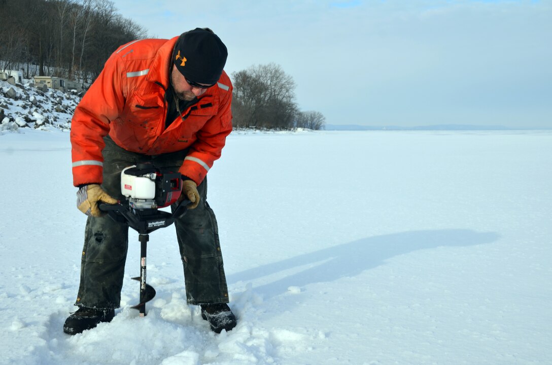 WABASHA, Minn. – Bill Chelmowski, U.S. Army Corps of Engineers, St. Paul District marine machinery mechanic, uses an ice auger to drill a hole on Lake Pepin, near Wabasha, Minn., Feb. 13, during the first Mississippi River ice surveys of the year. The district conducts the annual ice surveys to help the navigation industry determine when it is safe to break through the ice. Lake Pepin, located on the Mississippi River between Red Wing and Wabasha, Minn., is used as the benchmark because the ice melts slower in this area due to the lake width and the slower current.