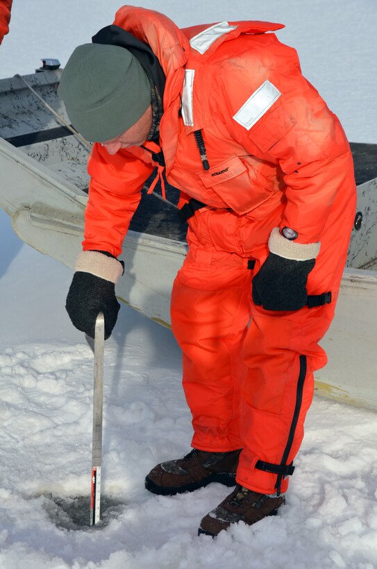 WABASHA, Minn. – Al VanGuilder, St. Paul District survey technician, measures ice on Lake Pepin, near Wabasha, Minn., Feb. 13, during the first Mississippi River ice surveys of the year. The district conducts the annual ice surveys to help the navigation industry determine when it is safe to break through the ice. Lake Pepin, located on the Mississippi River between Red Wing and Wabasha, Minn., is used as the benchmark because the ice melts slower in this area due to the lake width and the slower current.