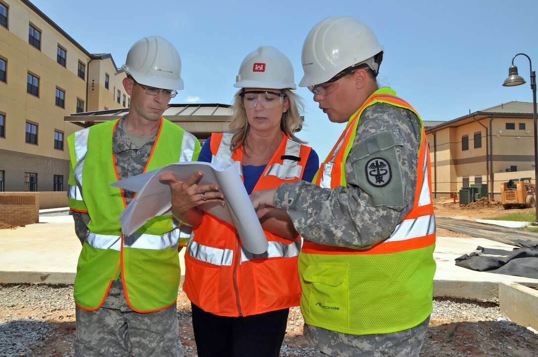 USACE employees discuss project decisions at Fort Campbell