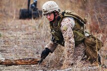 Staff Sgt. James A. Arbuthnot, a technician with 2nd Explosive Ordnance Disposal Company, 2nd Marine Logistics Group, probes the ground with a knife as he clears a path to the site of a simulated improvised explosive device during the unit’s training exercise at Camp Davis, N.C., Feb. 12, 2013. Arbuthnot later cleared the area of other additional threats by setting up a simulated explosive charge. 