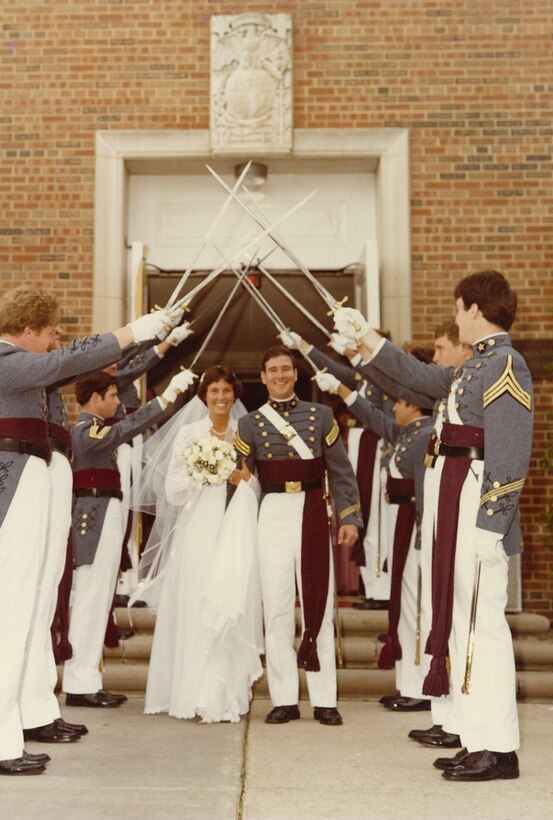 Stephen and Karen Chase leave the base chapel after their wedding ceremony under the swords of Virginia Military Institute cadets on May 24, 1980. The couple met in the hallways of Quantico Middle/High School and are still committed to each other and the base. 