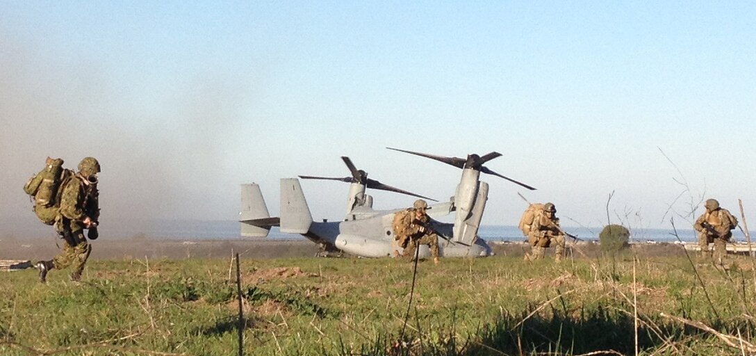 Members of the Japan Ground Self-Defense Force train alongside U.S. Marines with the MV-22B Osprey during the final key event of Exercise Iron Fist 2013 here, Feb 13. It marked the first time JGSDF troops with the Western Army Infantry Regiment trained with the Osprey aircraft. During the exercise, the 13th Marine Expeditionary Unit and JGSDF have been conducting bilateral training to improve their interoperability, enhance military-to-military relations, and sharpen skills essential to crisis response.