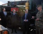 Col. John E. Kasperski, right, discusses some of the functions of Combat Logistics Regiment 35 Feb. 5 at Camp Kinser with, left to right, Alfred R. Magleby, Matt O’Connor and John E. Buhler of the Consulate General’s office, Naha. Magleby and his colleagues visited the camp to gain a better understanding of
some of its functions. Kasperski is the Camp Kinser commander and Magleby is the consul general, Naha.

