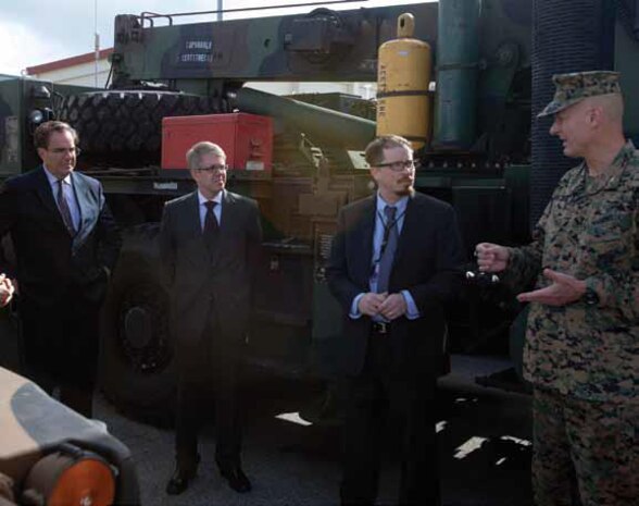 Col. John E. Kasperski, right, discusses some of the functions of Combat Logistics Regiment 35 Feb. 5 at Camp Kinser with, left to right, Alfred R. Magleby, Matt O’Connor and John E. Buhler of the Consulate General’s office, Naha. Magleby and his colleagues visited the camp to gain a better understanding of
some of its functions. Kasperski is the Camp Kinser commander and Magleby is the consul general, Naha.
