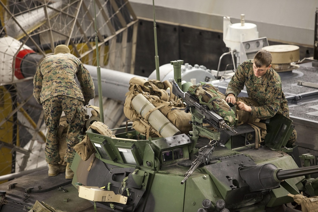 Marines assigned to Battalion Landing Team (BLT) 3/2, 26th Marine Expeditionary Unit (MEU), load their Light Armored Vehicle aboard a Landing Craft, air cushion (LCAC) during an alert status drill in the well deck of USS Kearsarge (LHD 3), Jan. 27, 2013. The MEU and Amphibious Squadron (PHIBRON) 4 are conducting PHIBRON-MEU Integration in preparation for their Composite Training Unit Exercise, the final phase of a six-month pre-deployment training program. The 26th MEU operates continuously across the globe, providing the president and unified combatant commanders with a forward-deployed, sea-based quick reaction force. The MEU is a Marine Air-Ground Task Force capable of conducting amphibious operations, crisis response and limited contingency operations. (U.S. Marine Corps photo by Cpl. Christopher Q. Stone/Released)