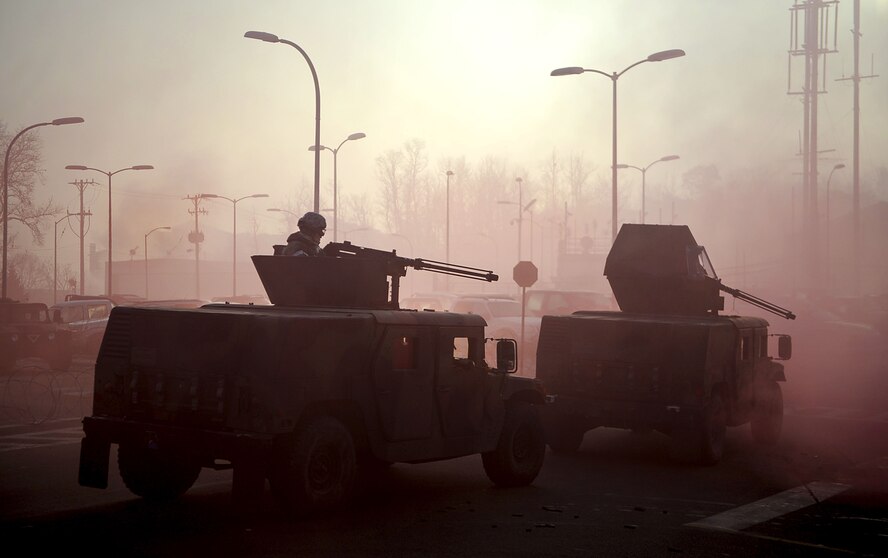 Airmen from the 51st Security Forces Squadron secure the 51st Fighter Wing’s headquarters building during the last counter surveillance scenario during an operation readiness exercise, Beverly Bulldog 13-02 at Osan Air Base, Republic of Korea, Feb. 15, 2013. Counter surveillance scenarios are conducted throughout the ORE in order to help security forces Airmen learn how to better secure the base and defend against opposing forces. (U.S. Air Force photo/Staff Sgt. Sara Csurilla)