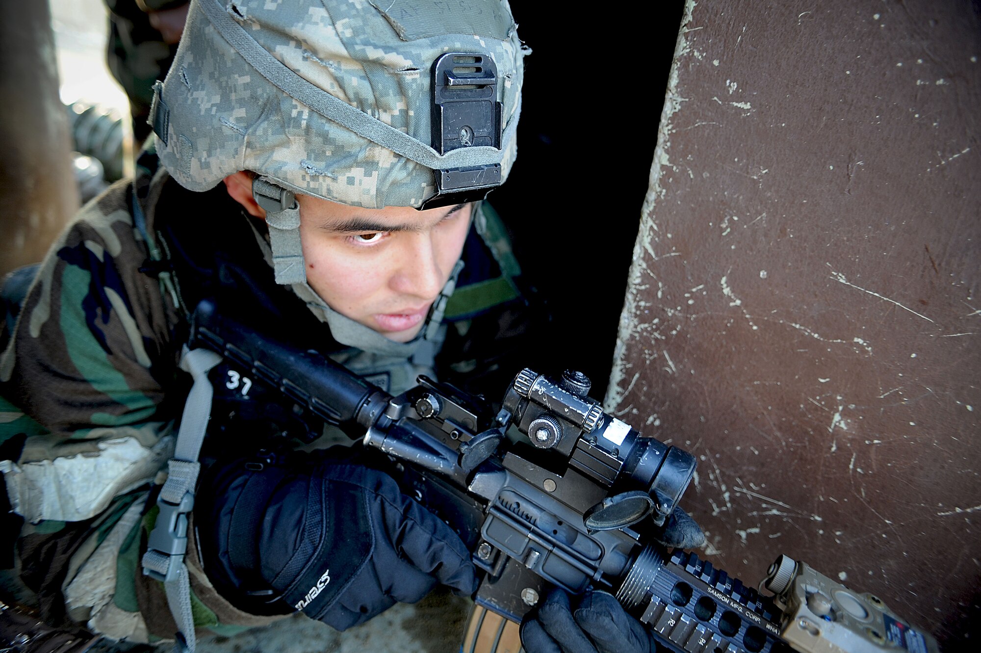 Staff Sgt. Joshua Holmes, 51st Security Forces Squadron member, secures a bunker located at the wing headquarters building during the last counter surveillance scenario during operation readiness exercise Beverly Bulldog 13-02 at Osan Air Base, Republic of Korea, Feb. 15, 2013. Counter surveillance scenarios are conducted throughout the ORE in order to help security forces Airmen learn how to better secure the base and defend against opposing forces. (U.S. Air Force photo/Staff Sgt. Sara Csurilla)