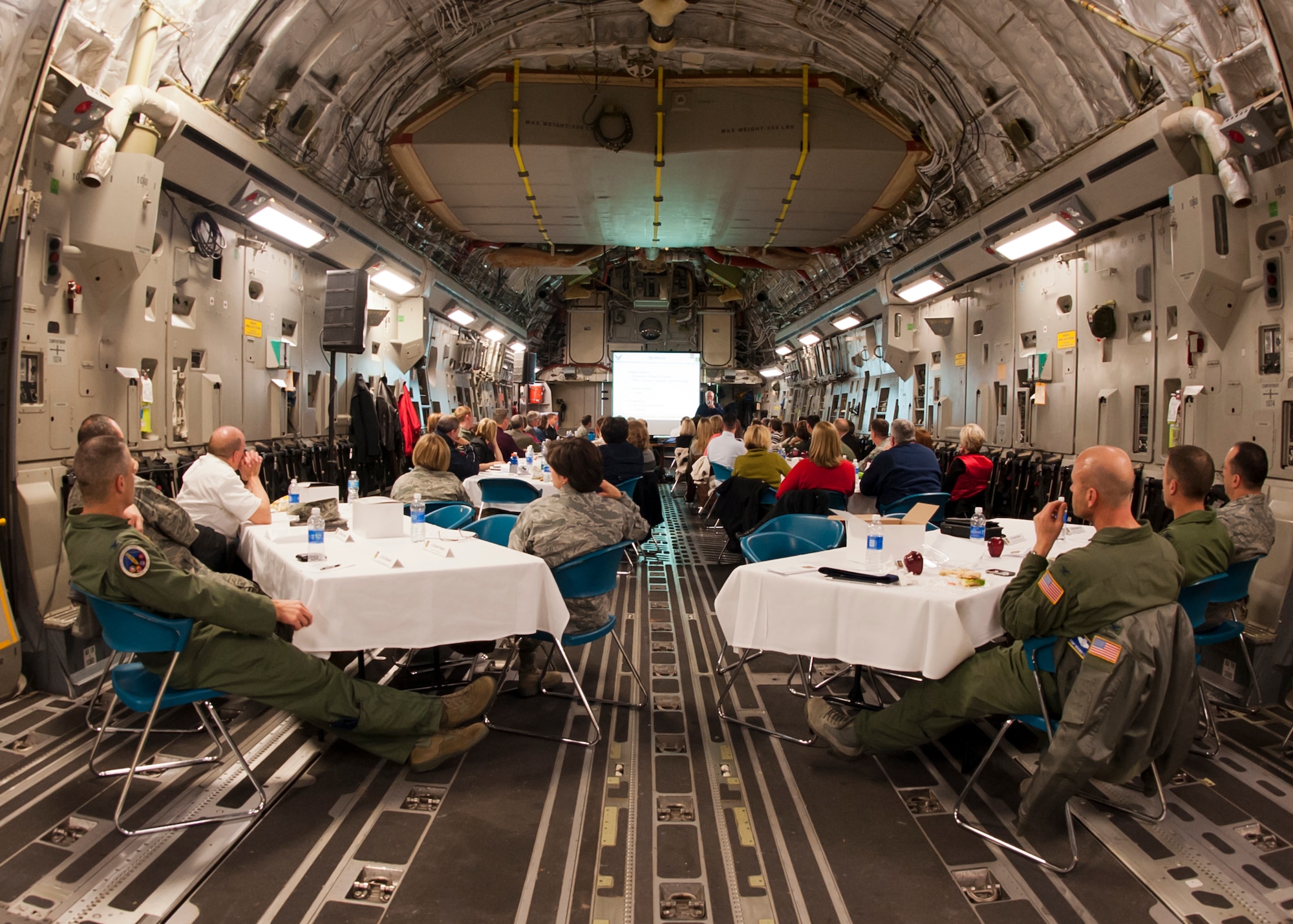ALTUS AIR FORCE BASE, Okla. – Altus AFB personnel and local educators watch a presentation inside a C-17 Globemaster III during the Science, Technology, Engineering and Mathematics Faculty Development Day, Feb. 13. The presentation focused on Altus AFB’s efforts to illustrate real-world applications to inspire students to start and continue studies in STEM. (U.S. Air Force photo by Airman 1st Class Levin Boland / Released)