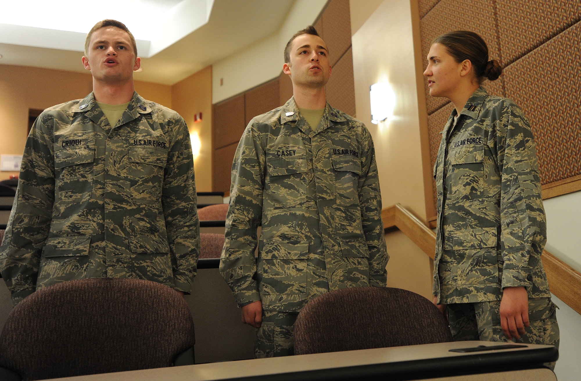 [Left to right] Shane Criqui and Christian Casey, U.S. Air Force ROTC cadets, recite the second article of the Code of Conduct to Cadet Anna Baughan during a “Career Day” leadership laboratory at Kansas State University Feb. 7, 2013, Manhattan, Kan.  More than 20 company grade officers from McConnell AFB attended the event and provided mentorship to cadets. They discussed topics ranging from McConnell’s mission, duty assignments and day-to-day life in the Air Force. (U.S.  Air Force Photo/2nd Lt. Jessica Brown)