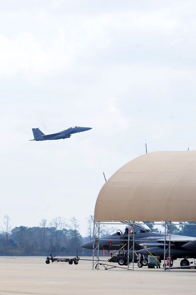 An F-15E Strike Eagle takes flight at a simulated deployed location during Operational Readiness Exercise Coronet Warrior 13-02 on Seymour Johnson Air Force Base, N.C., Feb. 14, 2013. Airmen in the 4th Fighter Wing worked together to accomplish their mission of providing "Dominant Strike Eagle Airpower...Anytime, Anyplace." (U.S. Air Force photo/Airman 1st Class Aubrey White/Released)