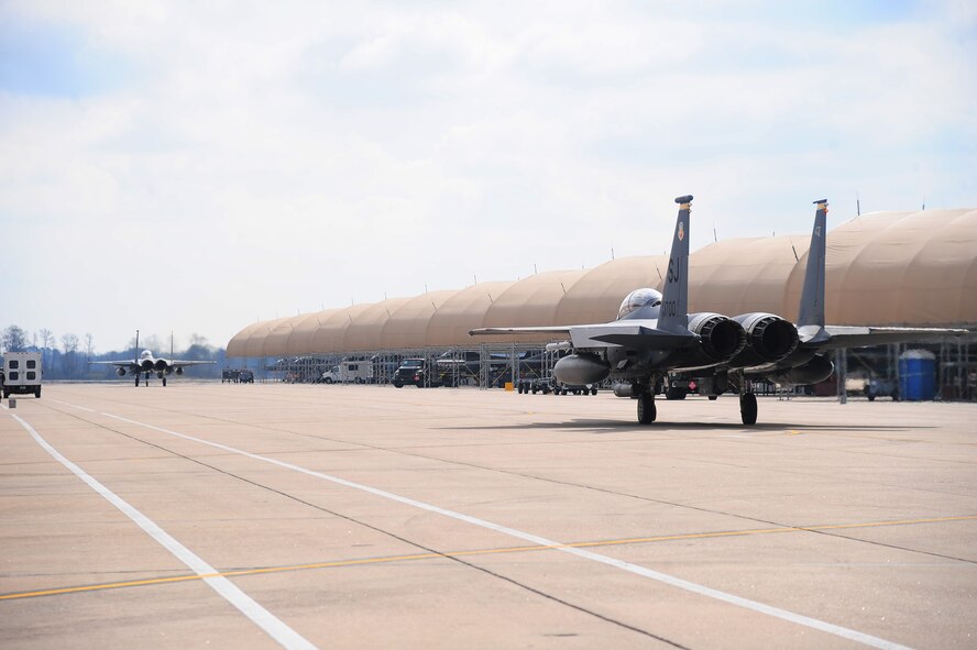 F-15E Strike Eagles taxi onto the flight line prior to take-off at a simulated deployed location during Operational Readiness Exercise Coronet Warrior 13-02 on Seymour Johnson Air Force Base, N.C., Feb. 14, 2013. Aircrew members and maintainers worked during fluctuating alarm conditions and mission oriented protective postures to ensure mission success. (U.S. Air Force photo/Airman 1st Class Aubrey White/Released)