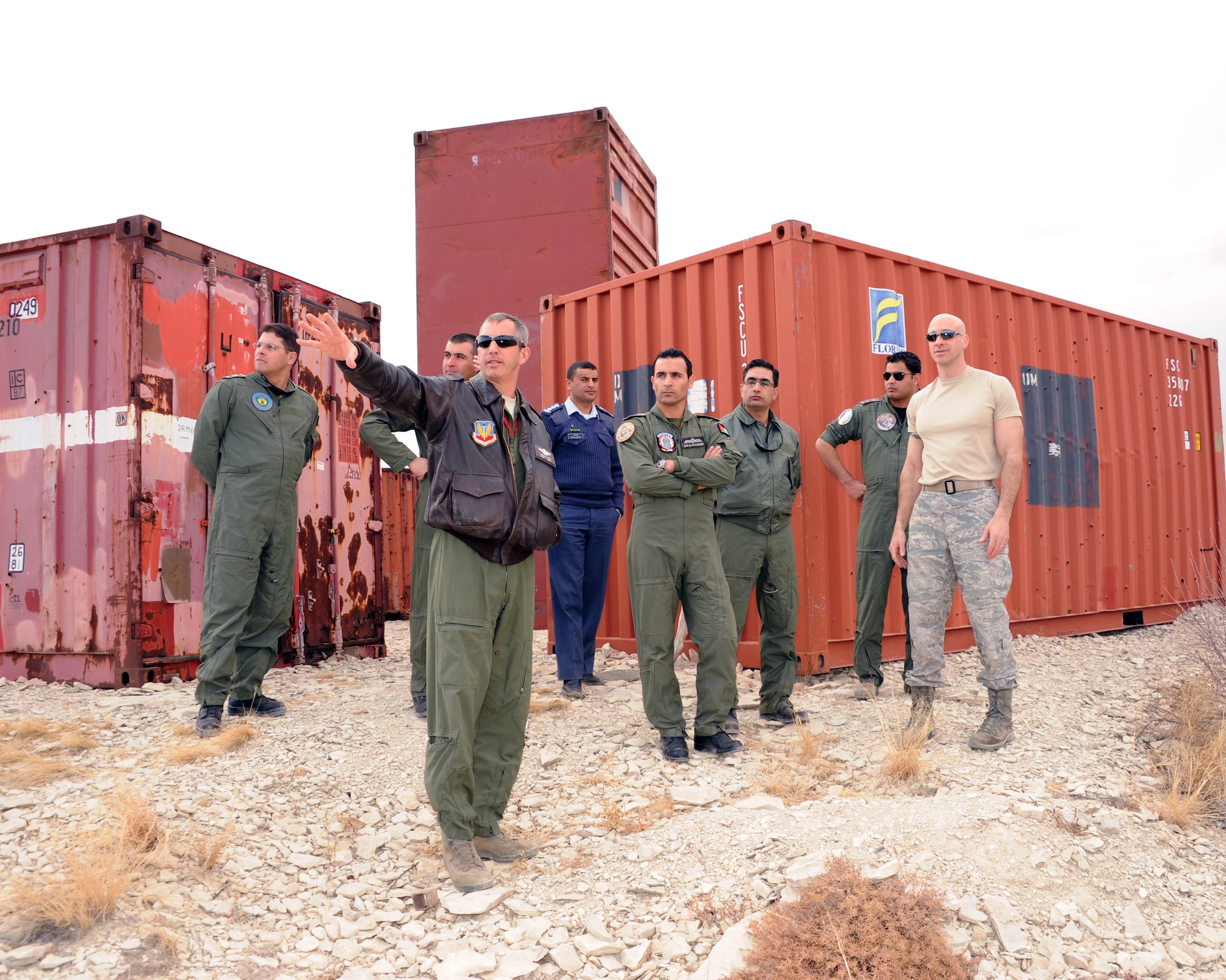 Colorado Air National Guard Lt. Col. Mitchell Neff (front center), chief of safety, 140th Wing, discusses risk mitigation and safety issues on the wing’s Airburst Range with Range Commander COANG Lt. Col. John Stevenson (right), 140th Operations Support Squadron, and visiting members of the Royal Jordanian Air Force, Feb. 6, 2013, during the State Partnership Program Aviation Safety Exchange. The group spent a day at the 140th Wing’s Airburst Range at Fort Carson, Colo., to watch F-16s drop practice bomb drops and strafe targets at low angle, and have the opportunity to witness how the wing’s safety programs work during F-16 missions.  (Air National Guard Photo / Senior Master Sgt. John P. Rohrer)