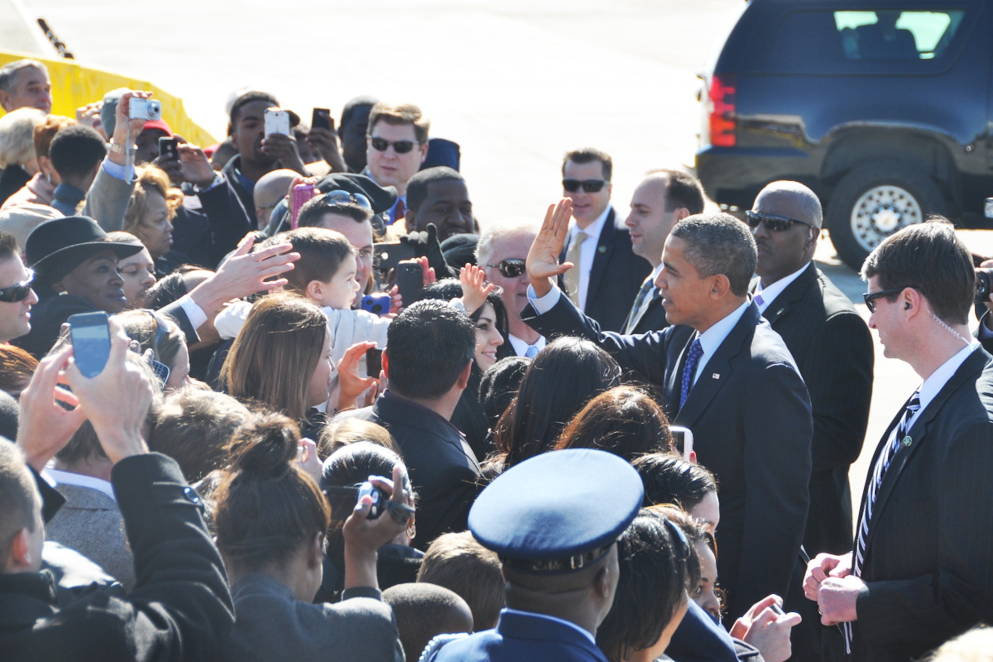 President Barack Obama gives a hi-five during his visit to Dobbins Air Reserve Base, Feb. 14. The president was en-route to the City of Decatur Recreation Center to discuss proposals outlined in his recent state of the union address. (U.S. Air Force photo/James Branch)
