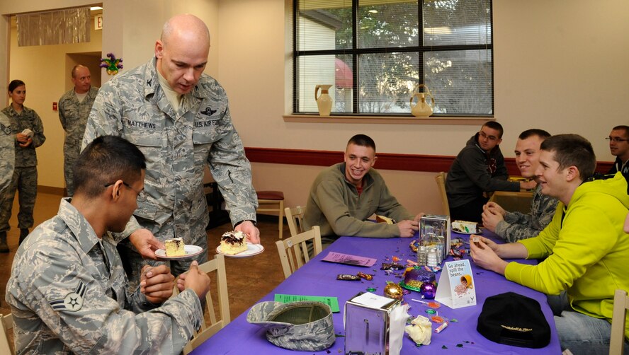Col. Patrick Matthews, 2nd Mission Support Group commander, serves cake to Airmen during the Airmen Birthday Meal on Barksdale Air Force Base, La., Feb. 13. Airmen whose birthdays fell between October 2012 and March 2013 were invited to the Red River Dining Facility for food, cake and games, served by commanders and first sergeants in appreciation of the efforts they give towards furthering Barksdale's mission of providing global air power. (U.S. Air Force photo/Airman 1st Class Andrew Moua)