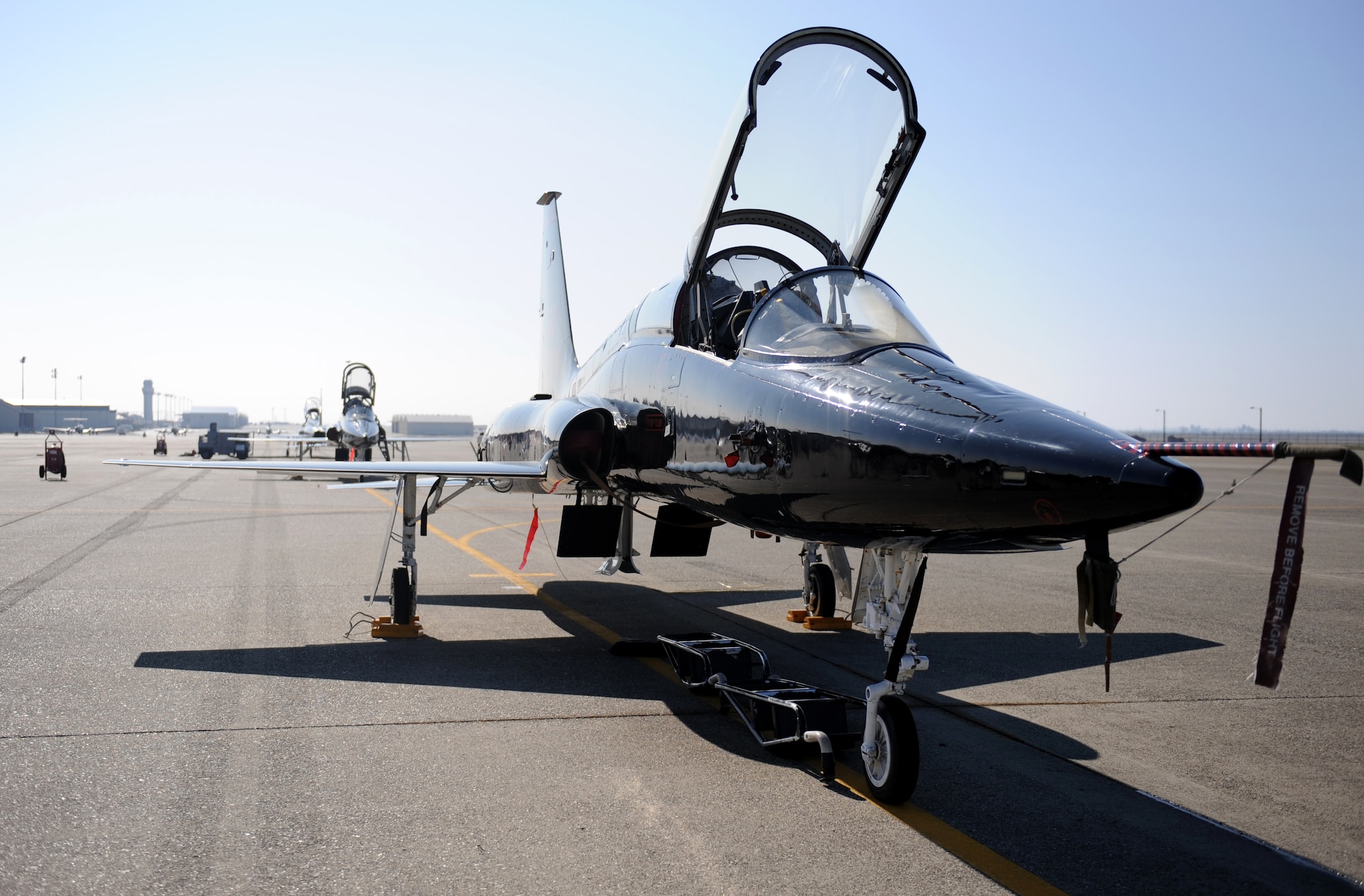A T-38 Talon jet trainer sits on the flight-line during a pilot rescue exercise on the flight-line at Beale Air Force Base, Calif., Feb. 13, 2013. Beale’s Talons are painted black to mirror the U-2 Dragon Lady. (U.S. Air Force photo by Staff Sgt. Robert M. Trujillo/Released)
