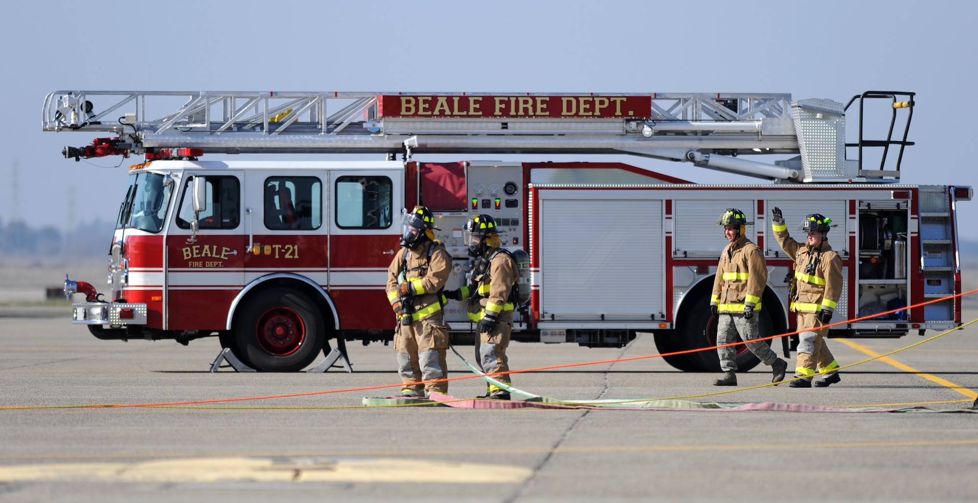 Beale firefighters conduct a pilot rescue exercise on the flight-line at Beale Air Force Base, Calif., Feb. 13, 2013. The fire department routinely runs various exercises to stay proficient. (U.S. Air Force photo by Staff Sgt. Robert M. Trujillo/Released)