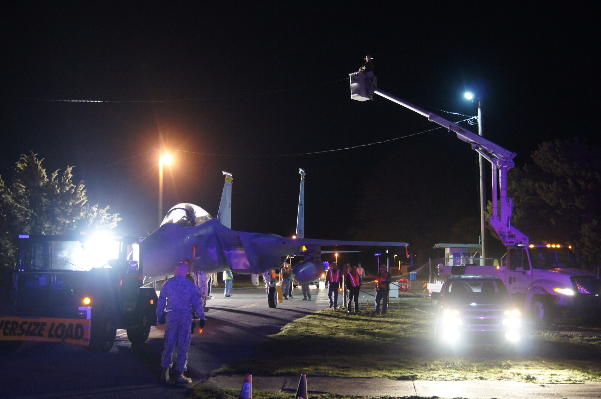 Early in the morning Feb. 10, it took a total team effort to move an F-15C Eagle from the flight line to the support side where it is scheduled to become a static display in front of the Killey Center.  There were participants from Air Forces Northern, the 325th Fighter Wing and local civil authorities. For more about the move, see Page 2. (Photo by Col. BJ Marshall)