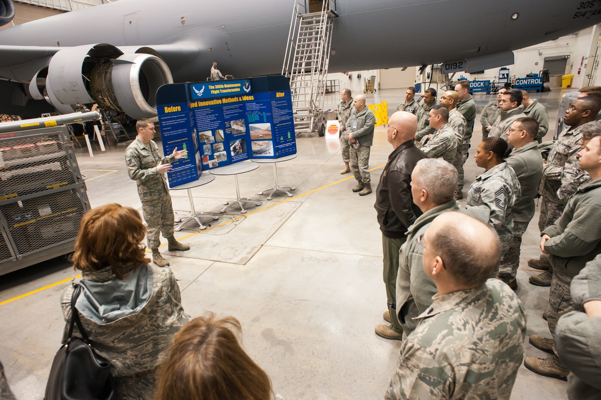 Cutline: Tech. Sgt. Zachari Schneider, 305th Maintenance Squadron dock chief, briefs senior leaders during the Air Force Smart Operations for the 21st Century (AFSO21) course Feb. 4, 2013, at hangar 2201 on Joint Base McGuire-Dix-Lakehurst, N.J. The AFSO21 course included a tour of the hangar's shop areas and classroom instruction on process improvement concepts. (U.S. Air Force photo by Russ Meseroll/Released)