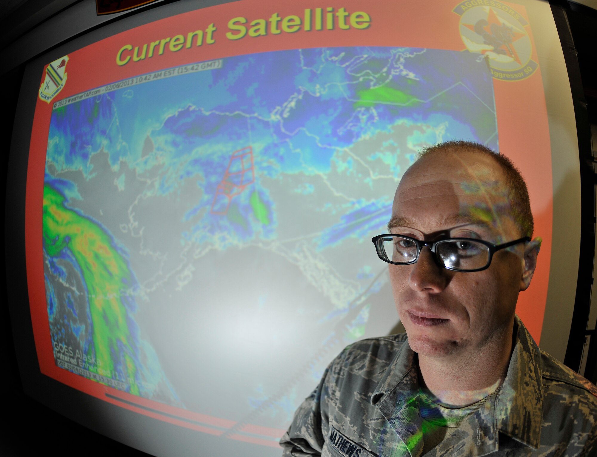 U.S. Air Force Senior Airman Phillip Mathews, 354th Operations Support Squadron weather technician, provides a weather briefing to pilots Feb. 6, 2013, Eielson Air Force Base, Alaska. Mathews educated pilots on various weather patterns they could encounter during flight missions. (U.S. Air Force photo/Senior Airman Racheal E. Watson)