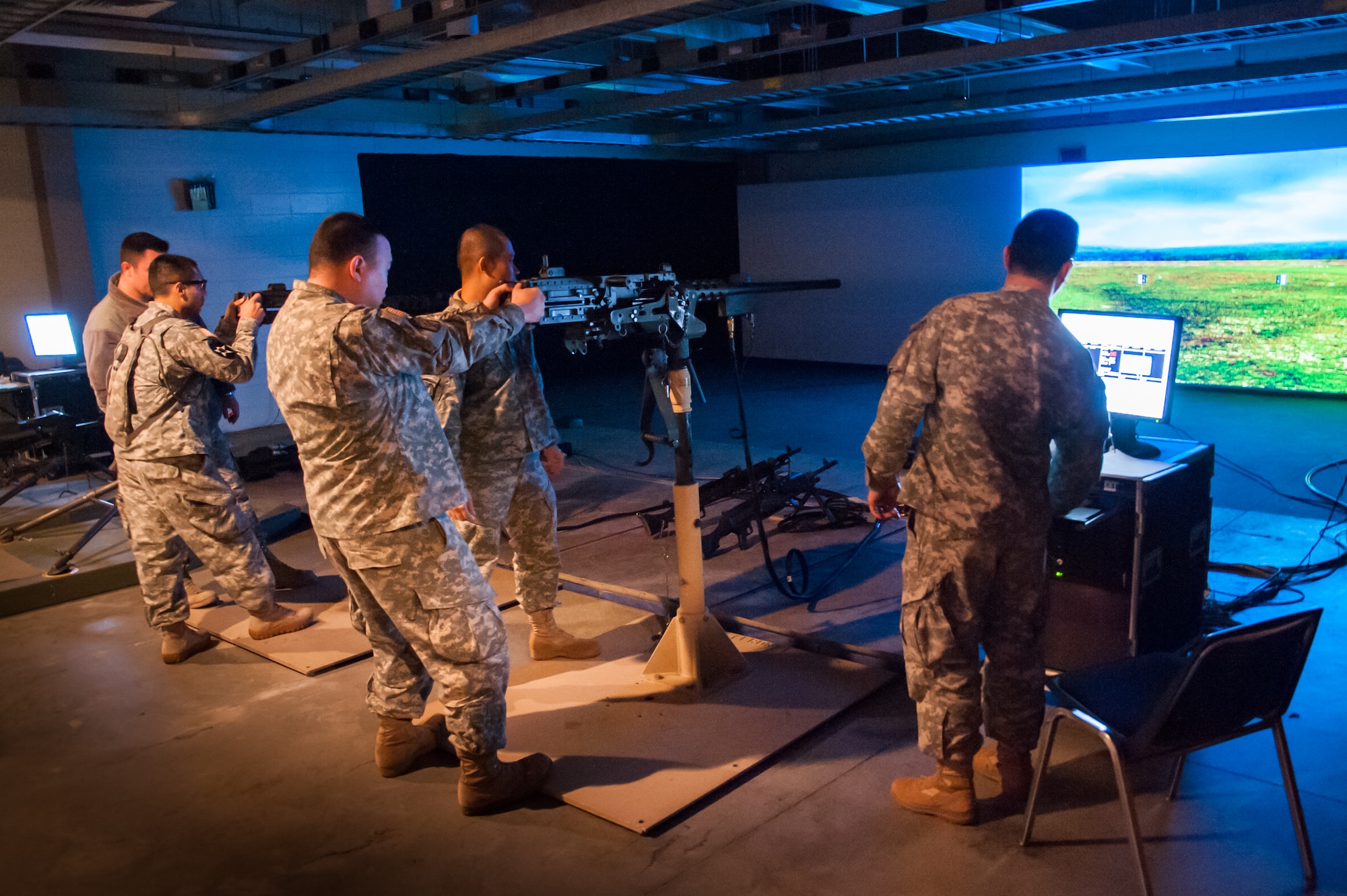 Master Sgt. Michael Kim, 78th Training Division small arms readiness group team chief, sets the distances on the engagement skills trainer for members of the 78th Training Division Feb. 6, 2013, Joint Training and Training Development Center Joint Base McGuire-Dix-Lakehurst, N.J. The 78th Training Division conducts the Combat Support Training Exercise and Warrior Exercise live fire Program of 