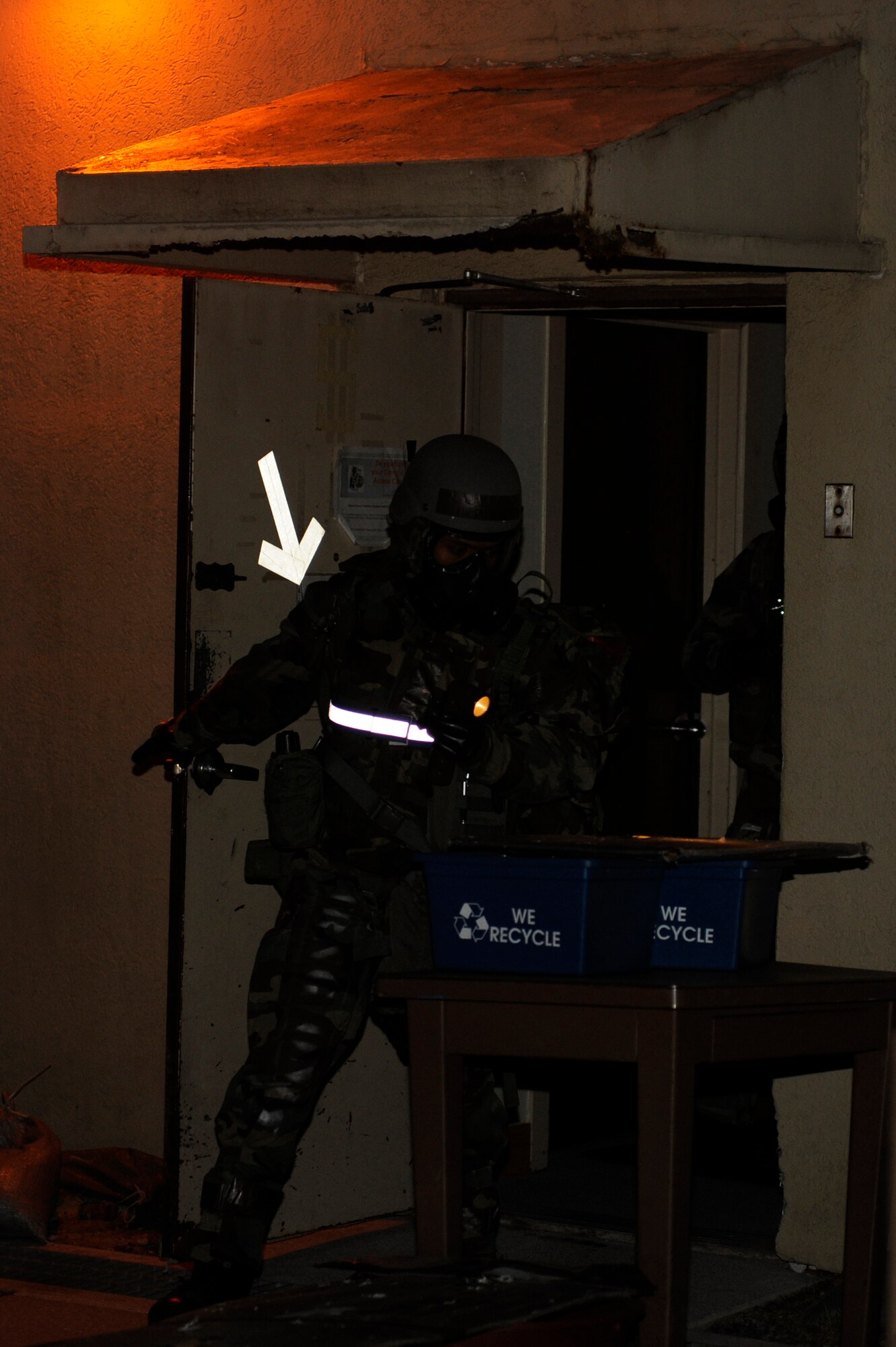 Staff Sgt. Ismael Tabual, 8th Comptroller Squadron, conducts an initial post-attack reconnaissance sweep during exercise Beverly Bulldog 13-2 at Kunsan Air Base, Republic of Korea, Feb. 14, 2013. PAR teams are used after an attack to check for casualties, unexploded ordnance, contamination from chemical, biological, radiological, nuclear or explosive weapons, and damage to structures and equipment. (U.S. Air Force photo by Senior Airman Marcus Morris/Released)
