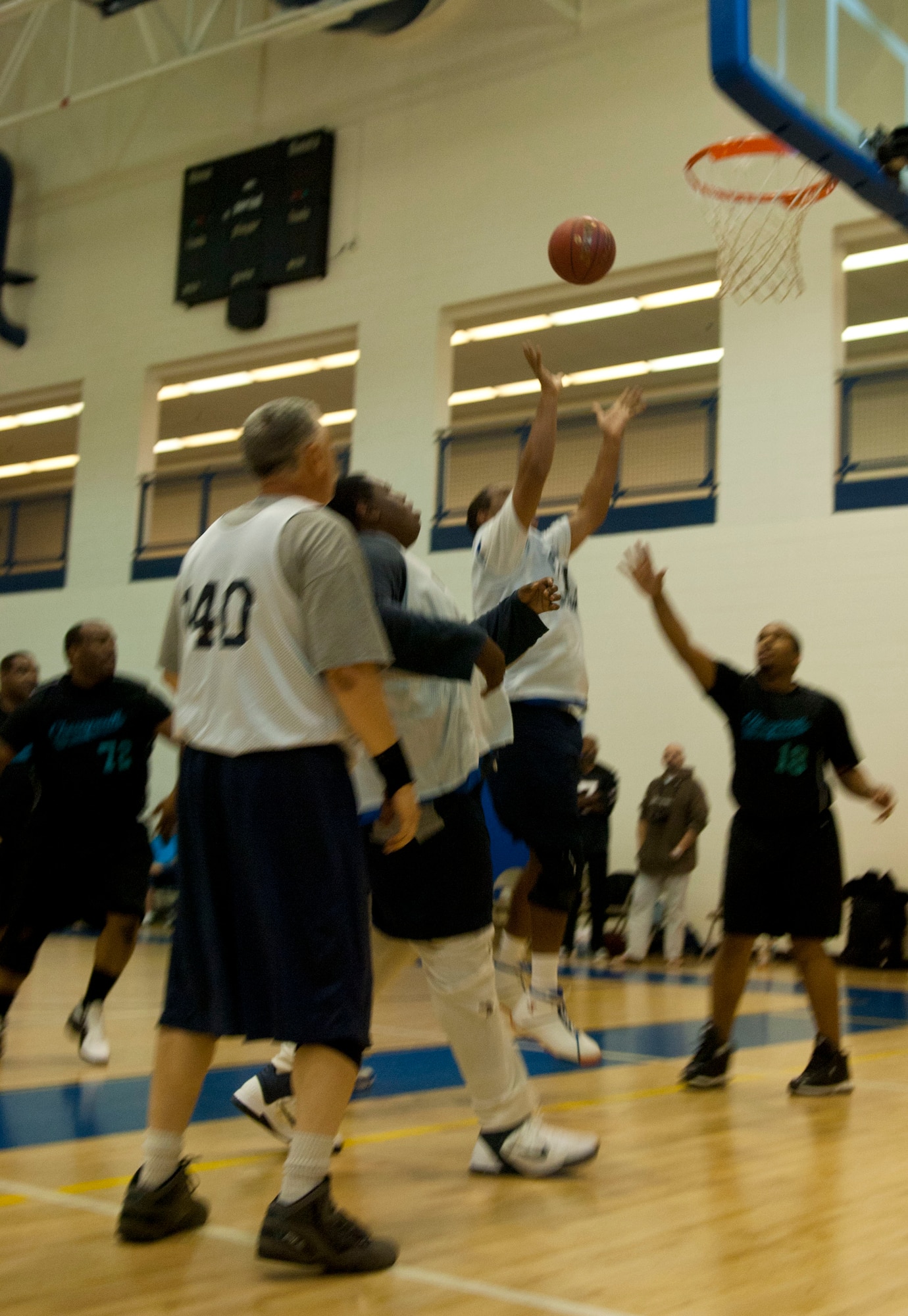 A Special Olympian powers through the defense to shoot a lay-up Feb. 9 at Langley Air Force Base Va., during the Special Olympics basketball tournament. The tournament was divided into half-court and full-court games. (U.S. Air Force photo by Airman 1st Class Austin Harvill/Released)