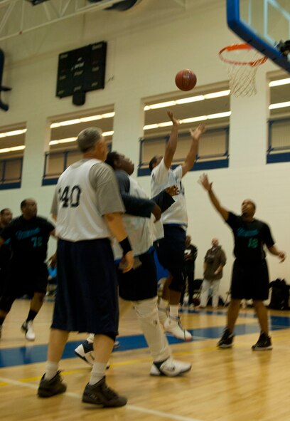 A Special Olympian powers through the defense to shoot a lay-up Feb. 9 at Langley Air Force Base Va., during the Special Olympics basketball tournament. The tournament was divided into half-court and full-court games. (U.S. Air Force photo by Airman 1st Class Austin Harvill/Released)