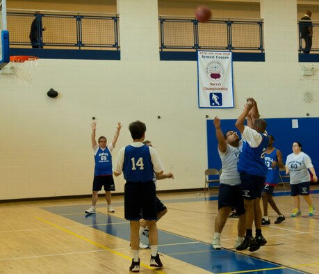 A Special Olympian shoots a three-point basket Feb. 9 at Langley Air Force Base, Va., during the Special Olympics basketball tournament. The teams were divided by age, capability and region. (U.S. Air Force photo by Airman 1st Class Austin Harvill/Released)
