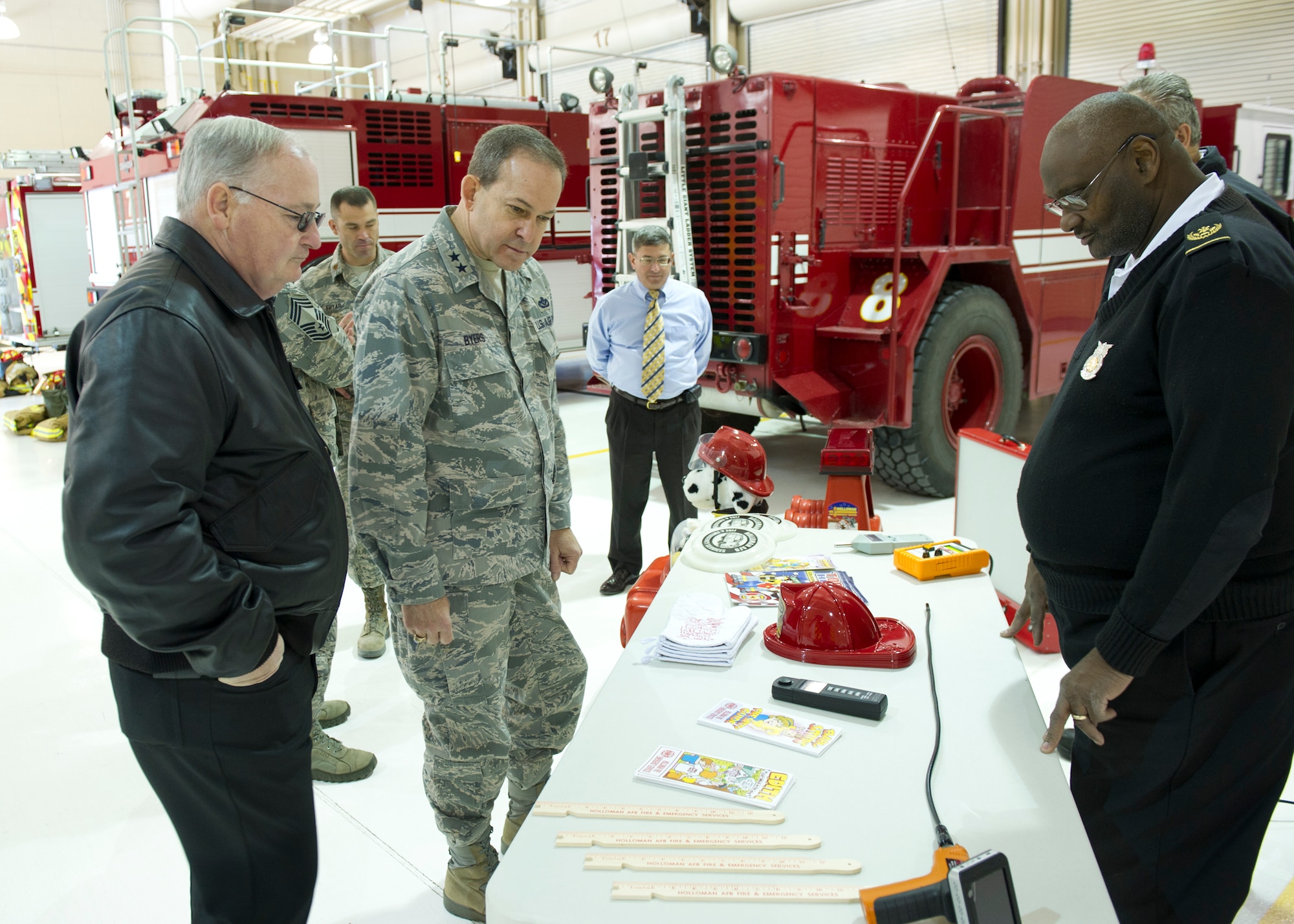 Major Gen. Timothy A. Byers, The Civil Engineer, Headquarters U.S. Air Force, Washington, is briefed by members of the 49th Civil Engineer Squadron fire protection flight, while touring Fire Station one at Holloman Air Force Base, N.M., Feb. 13. Here at Holloman Byers was able to see firsthand the many aspects of the base's mission. (U.S. Air Force photo by Senior Airman DeAndre Curtiss/Released)

