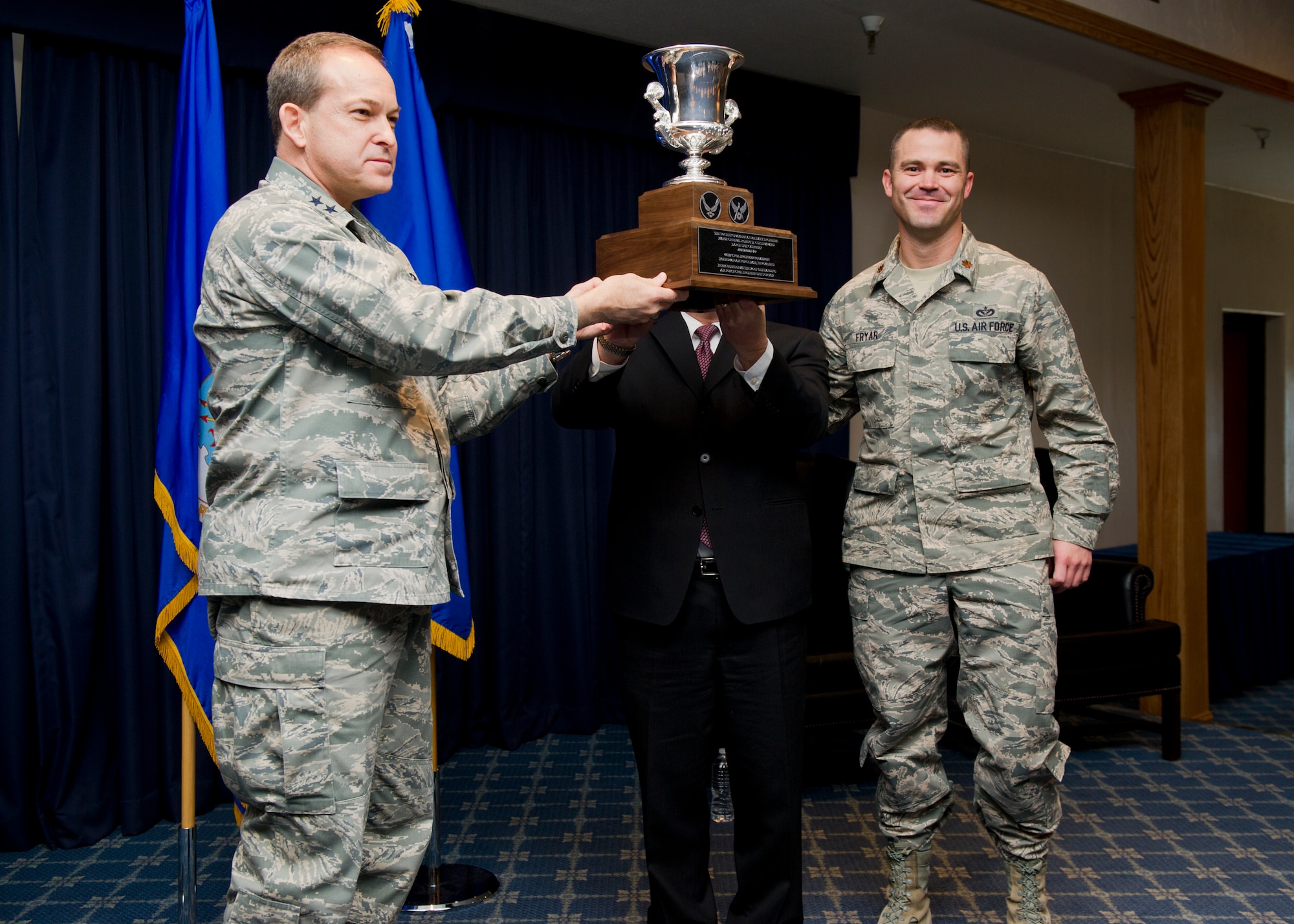Major Gen. Timothy A. Byers, The Civil Engineer, Headquarters U.S. Air Force, Washington, D.C., presents the Curtin Award for most outstanding large Civil Engineers unit for fiscal year 2012 to the 49th Civil Engineer Squadron at Holloman Air Force Base, N.M., Feb. 12. This is the first time the 49th CES has won the award since 1999. The 49th CES provides facility engineering, maintenance and repair programs sustaining an installation valued at $2.6 billion. (U.S. Air Force photo by Senior Airman DeAndre Curtiss/Released) 