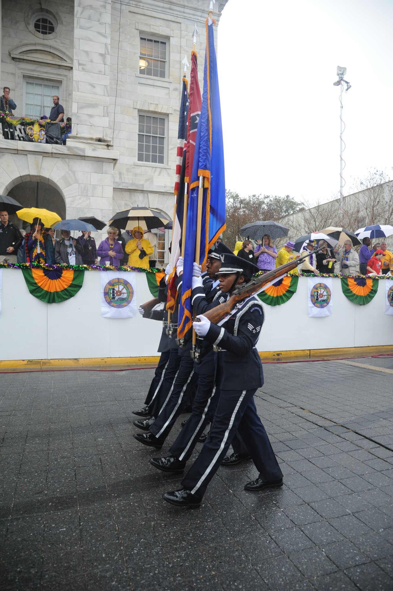 The Keesler Honor Guard leads the Gulf Coast Carnival Association Mardi Gras parade in Biloxi, Miss., Feb. 12, 2013. Lisa and Brig. Gen. Brad Spacy, 81st Training Wing commander, and Col. Craig LaFave, 403rd Wing commander, also participated in the festivities.  (U.S. Air Force photo by Kemberly Groue)